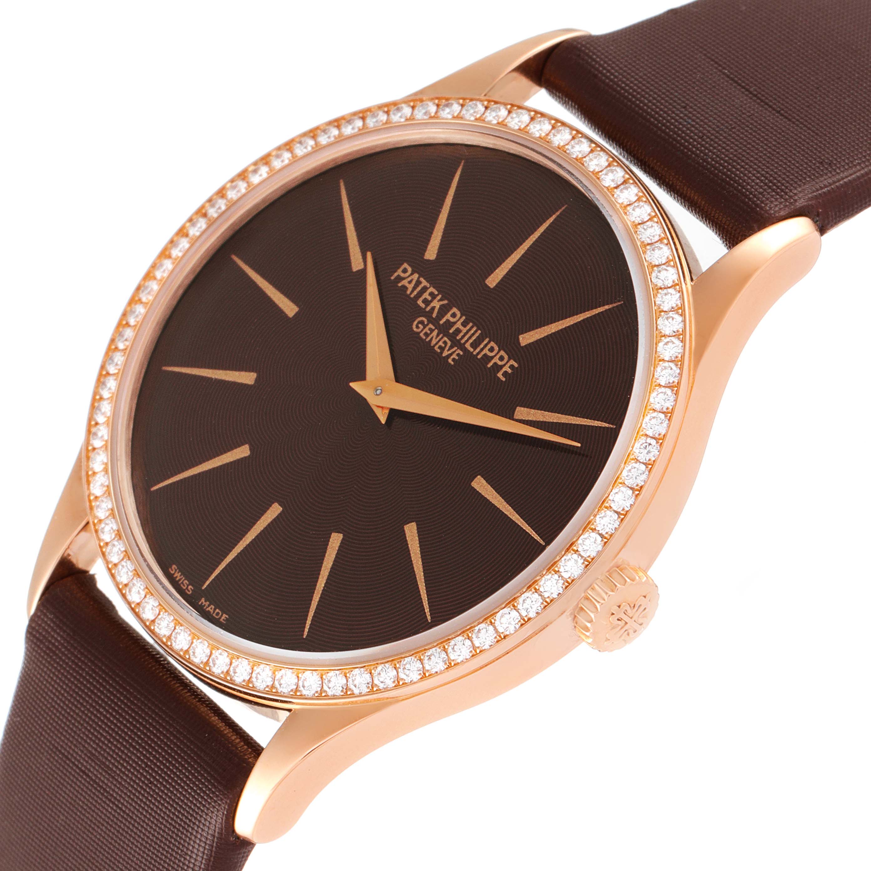 This image shows a Patek Philippe Calatrava 4897R-001 Women's Rose Gold Brown Dial 4897R-001 Women's Rose Gold Brown Dial watch from an angle highlighting its diamond bezel, dial, and crown.