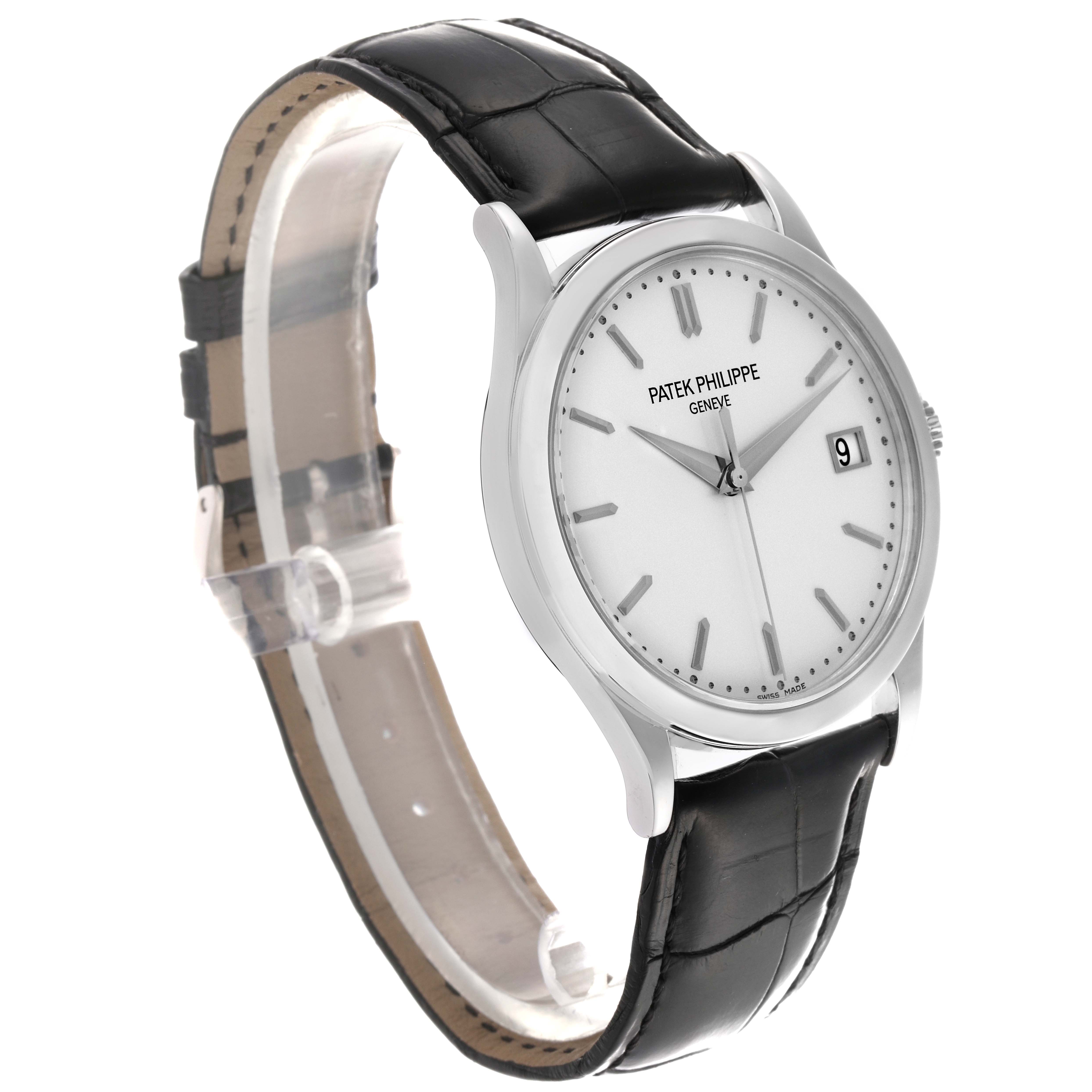 The Patek Philippe Calatrava 5296G-010 Men
s White Gold Silver Dial 5296G-010 Men
s White Gold Silver Dial watch is shown at a slight angle, highlighting the face, crown, and black leather strap.