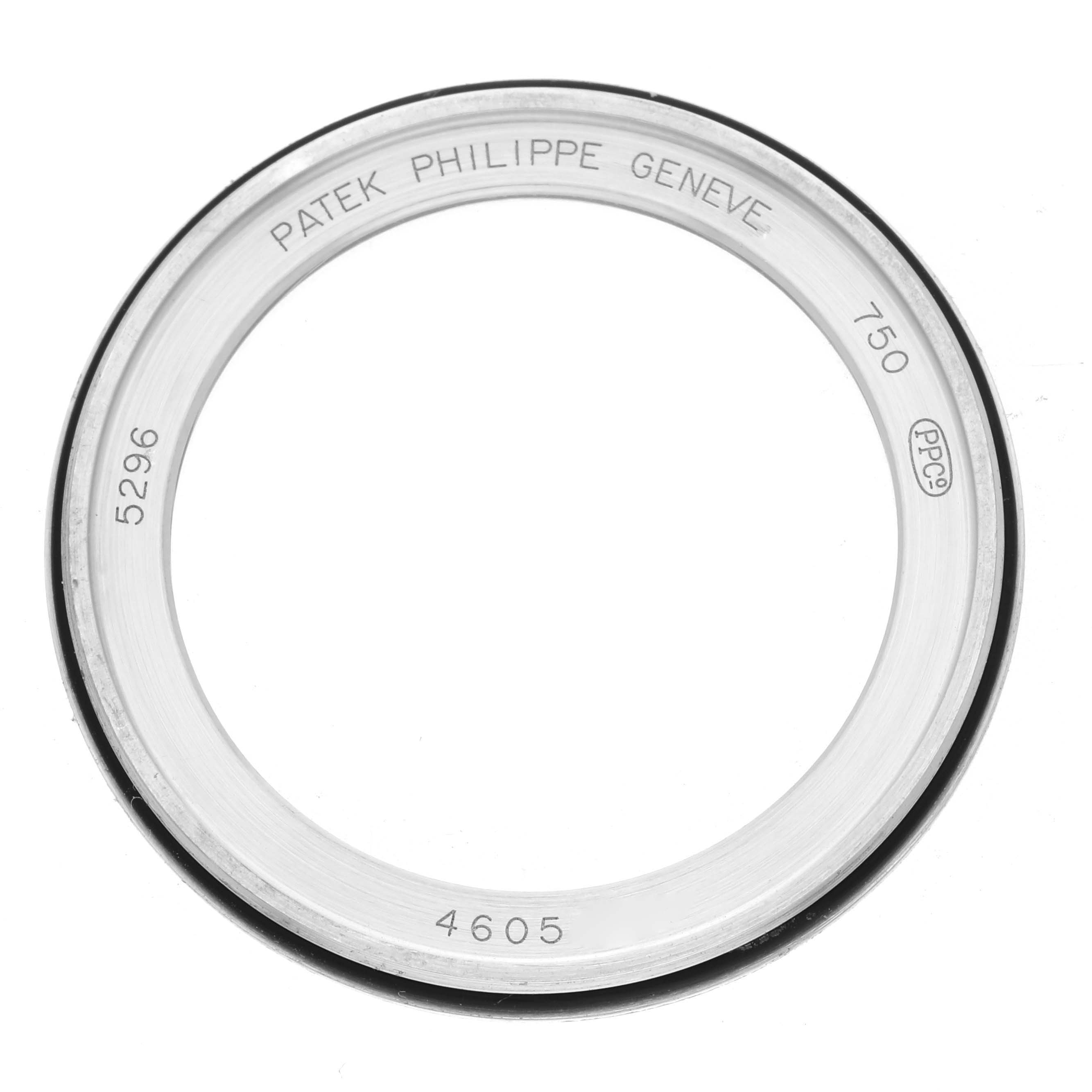 This image shows a bezel for the Patek Philippe Calatrava 5296G-010 Men
s White Gold Silver Dial 5296G-010 Men
s White Gold Silver Dial model from a top-down angle, displaying engravings and specifications.