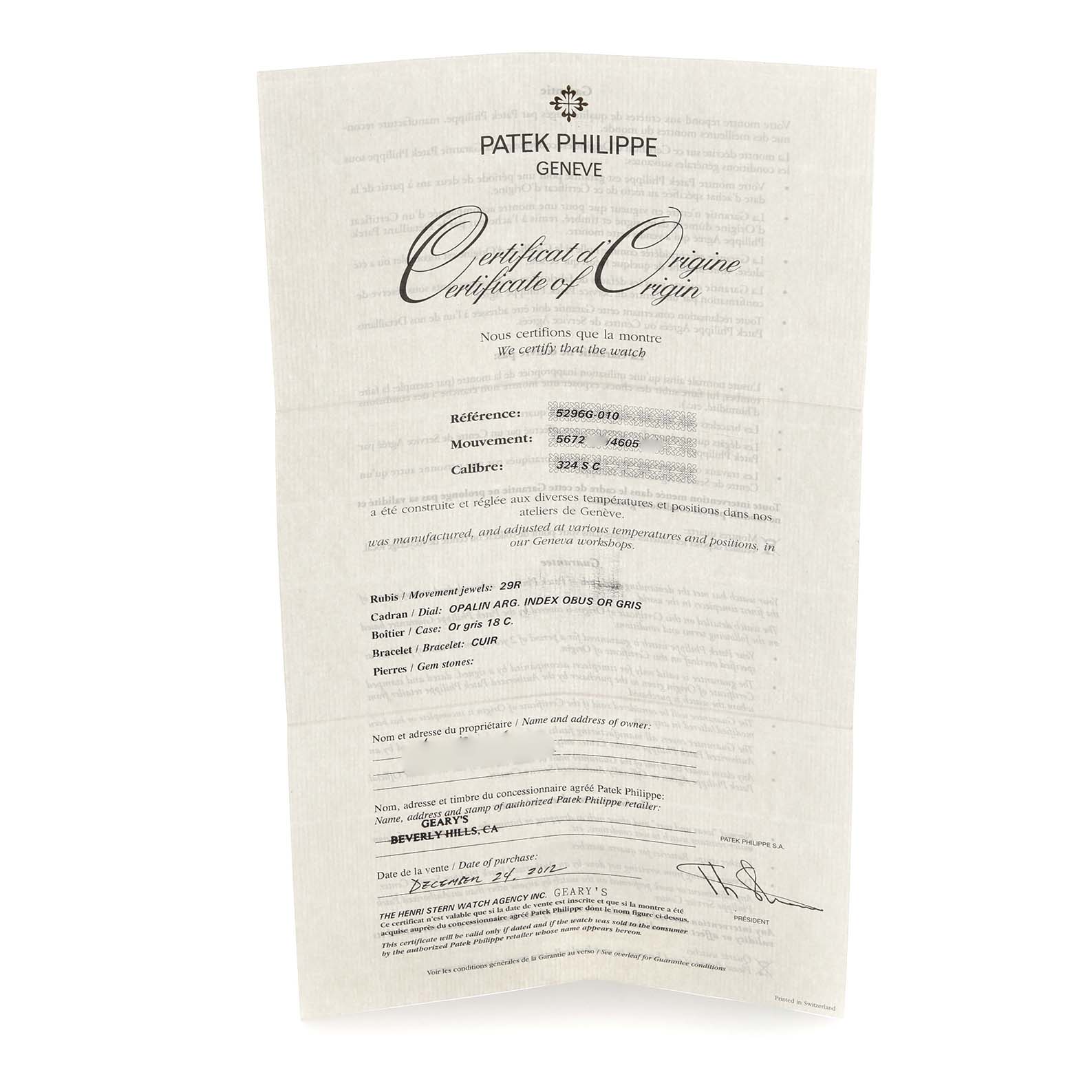 The image shows a Patek Philippe Calatrava 5296G-010 Men
s White Gold Silver Dial 5296G-010 Men
s White Gold Silver Dial certificate of origin document at a slight angle.