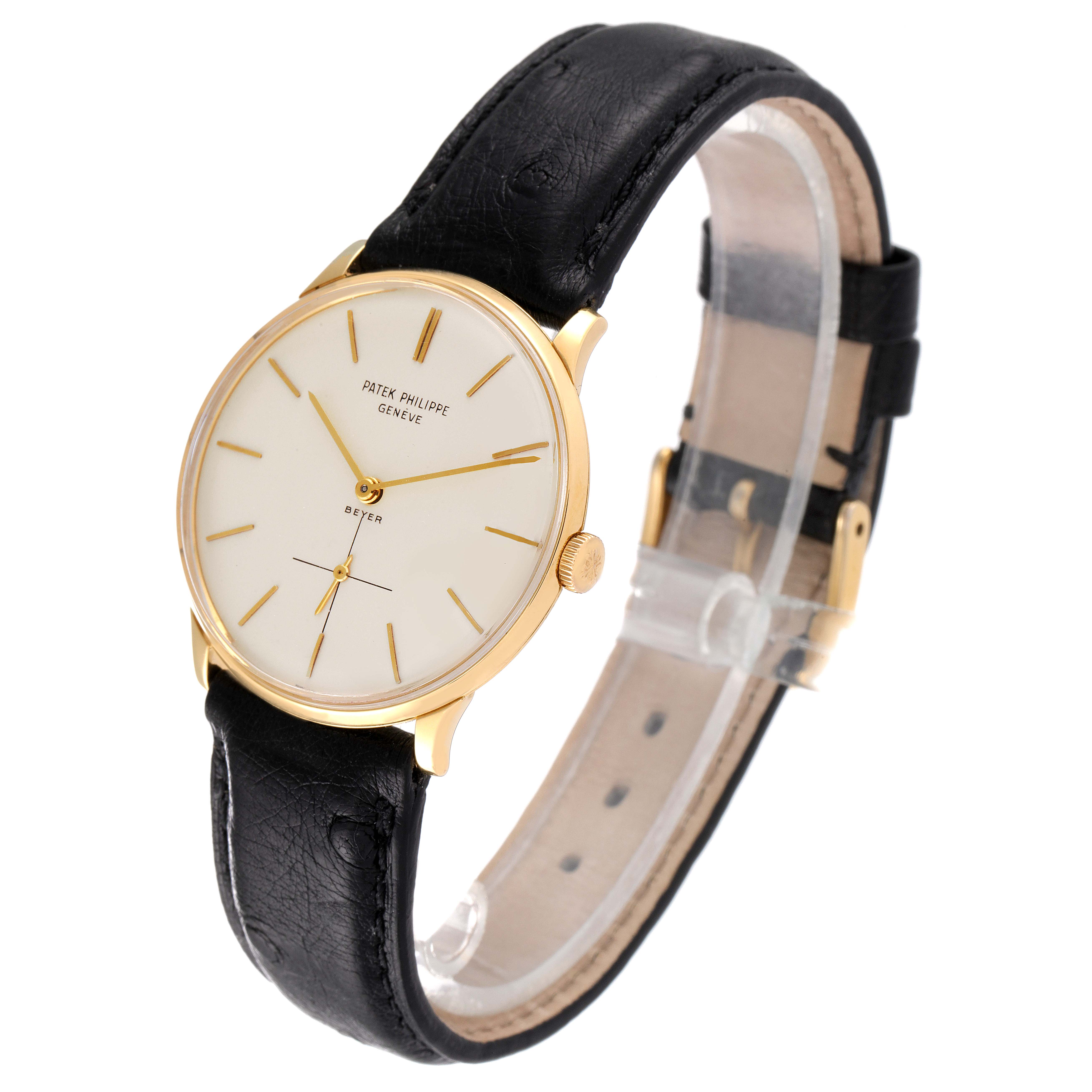 The image shows a side angle of a Vintage Patek Philippe watch, highlighting its gold case, black leather strap, and white dial.