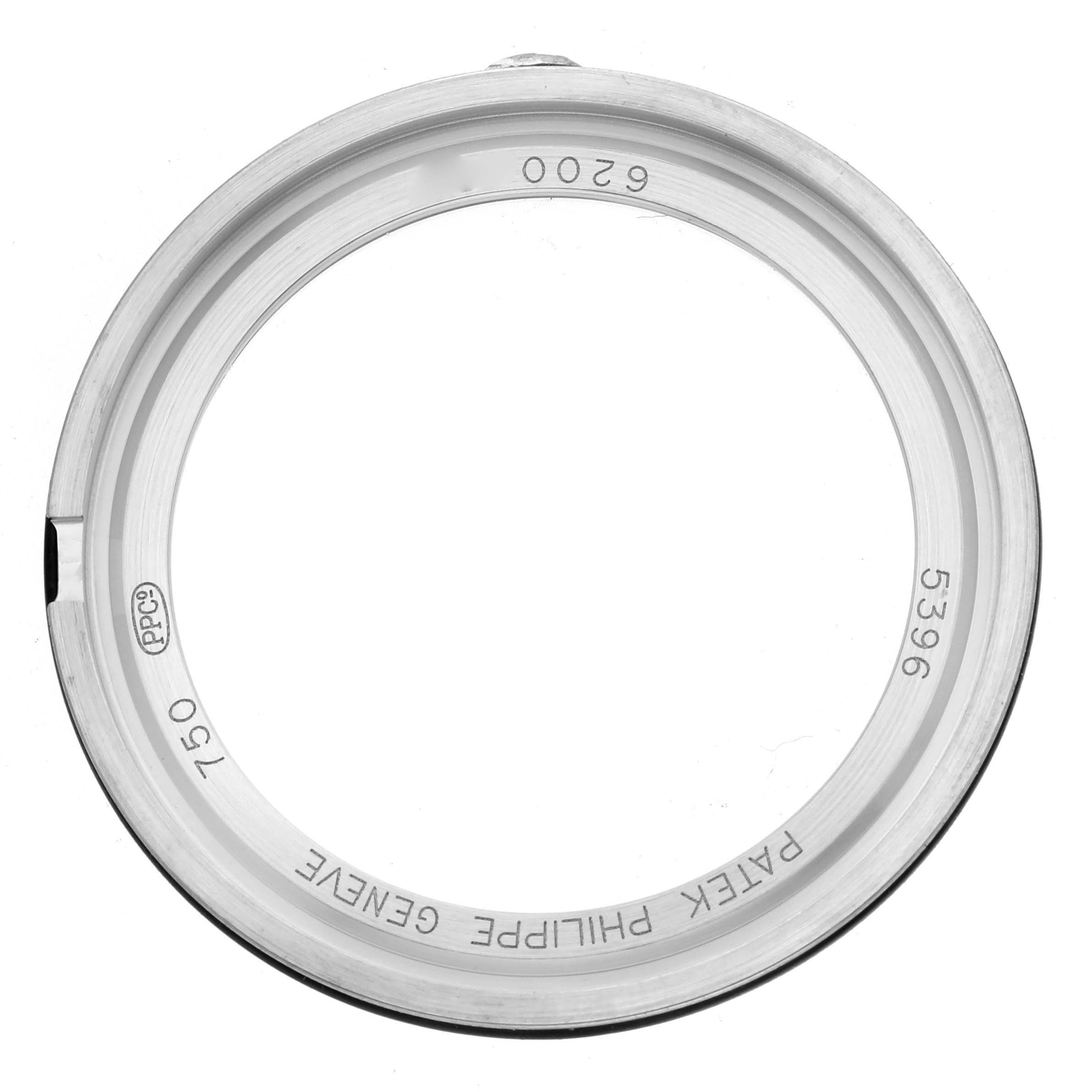 This image shows the back bezel of a Patek Philippe Complications 5396G-011 Men
s White Gold Silver Dial 5396G-011 Men
s White Gold Silver Dial 5396 watch, viewed from above, displaying engravings.