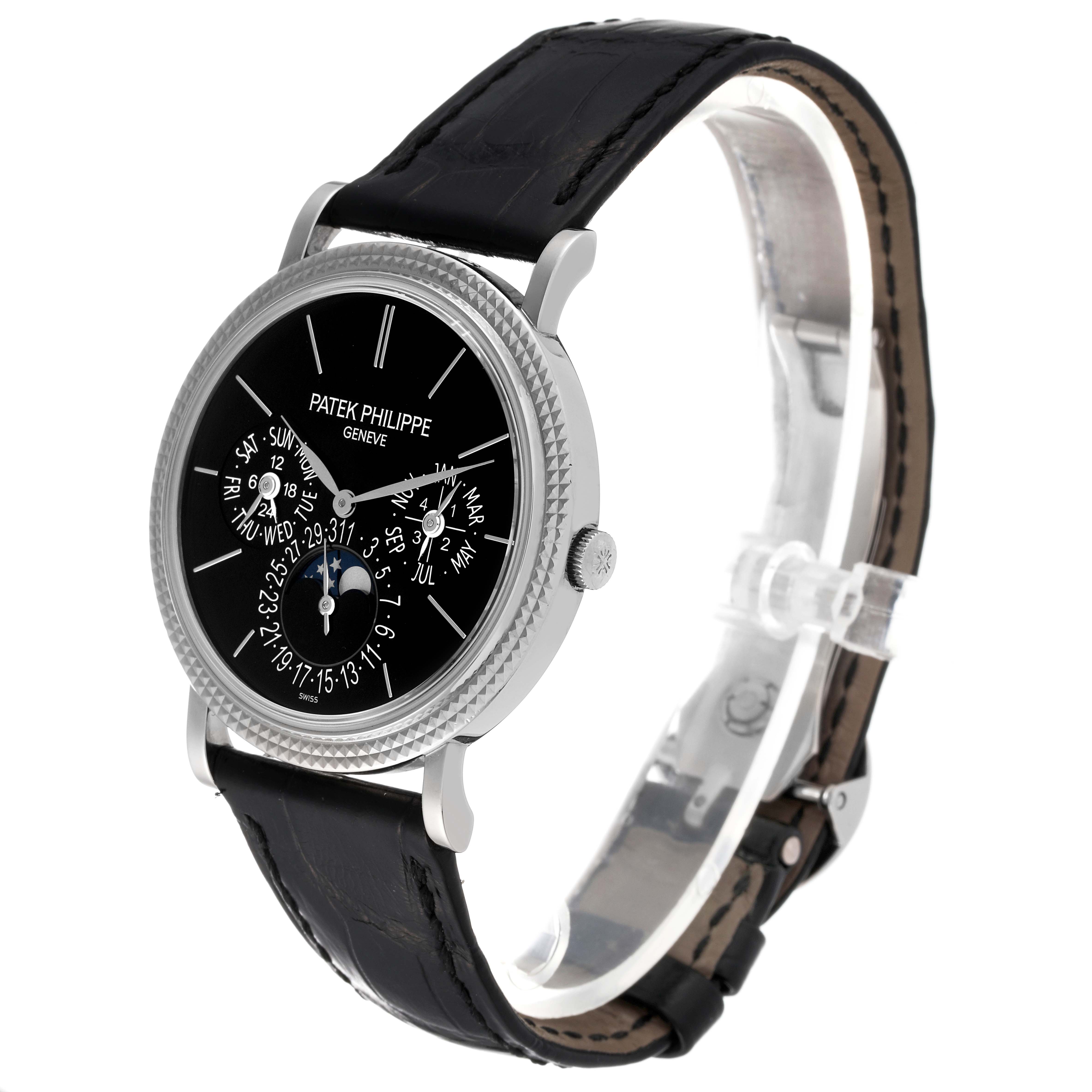 The image shows a side-angle view of the Patek Philippe Complications 5139G Men's White Gold Black Dial 5139G Men's White Gold Black Dial model watch, highlighting its black dial, intricate displays, and leather strap.