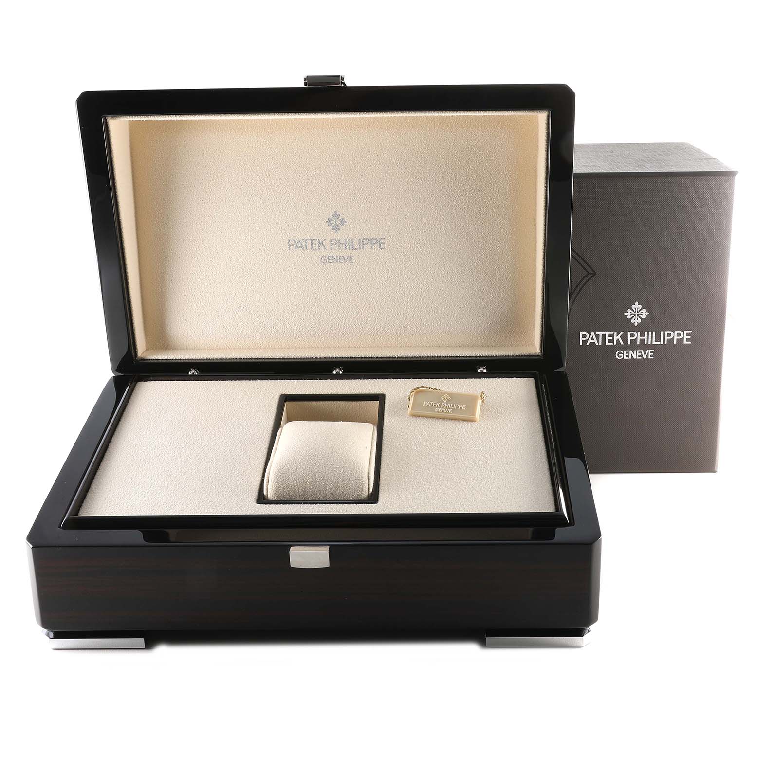 The image shows the open box for a Patek Philippe Complications 5139G Men's White Gold Black Dial 5139G Men's White Gold Black Dial model watch, highlighting the interior cushion and tag.
