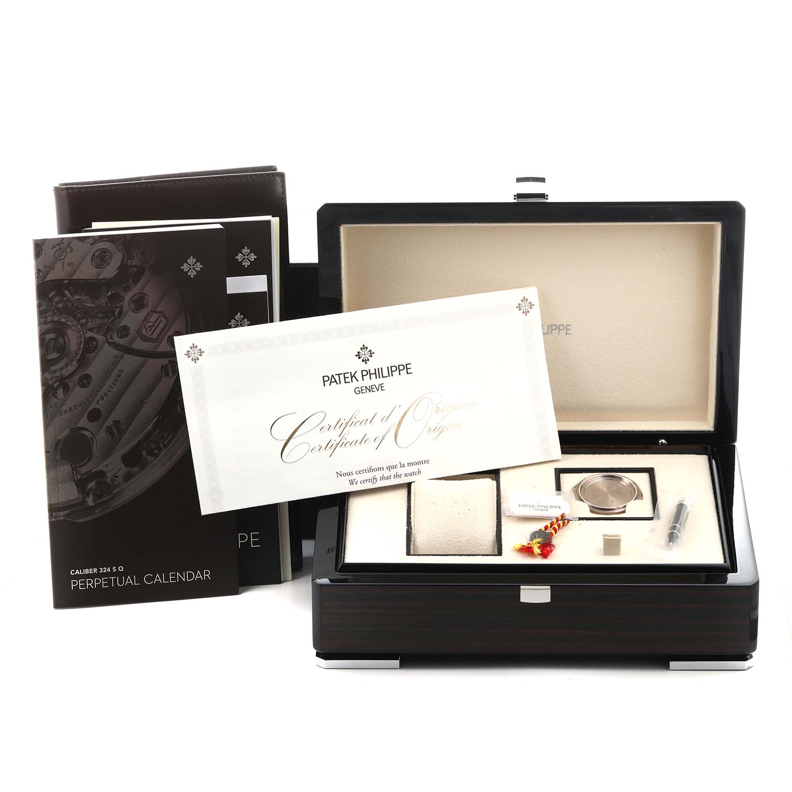 The Patek Philippe Complications 5320G-001 Men's White Gold White Dial 5320G-001 Men's White Gold White Dial model is shown in its box with a certificate, manuals, and tools, viewed from the front.