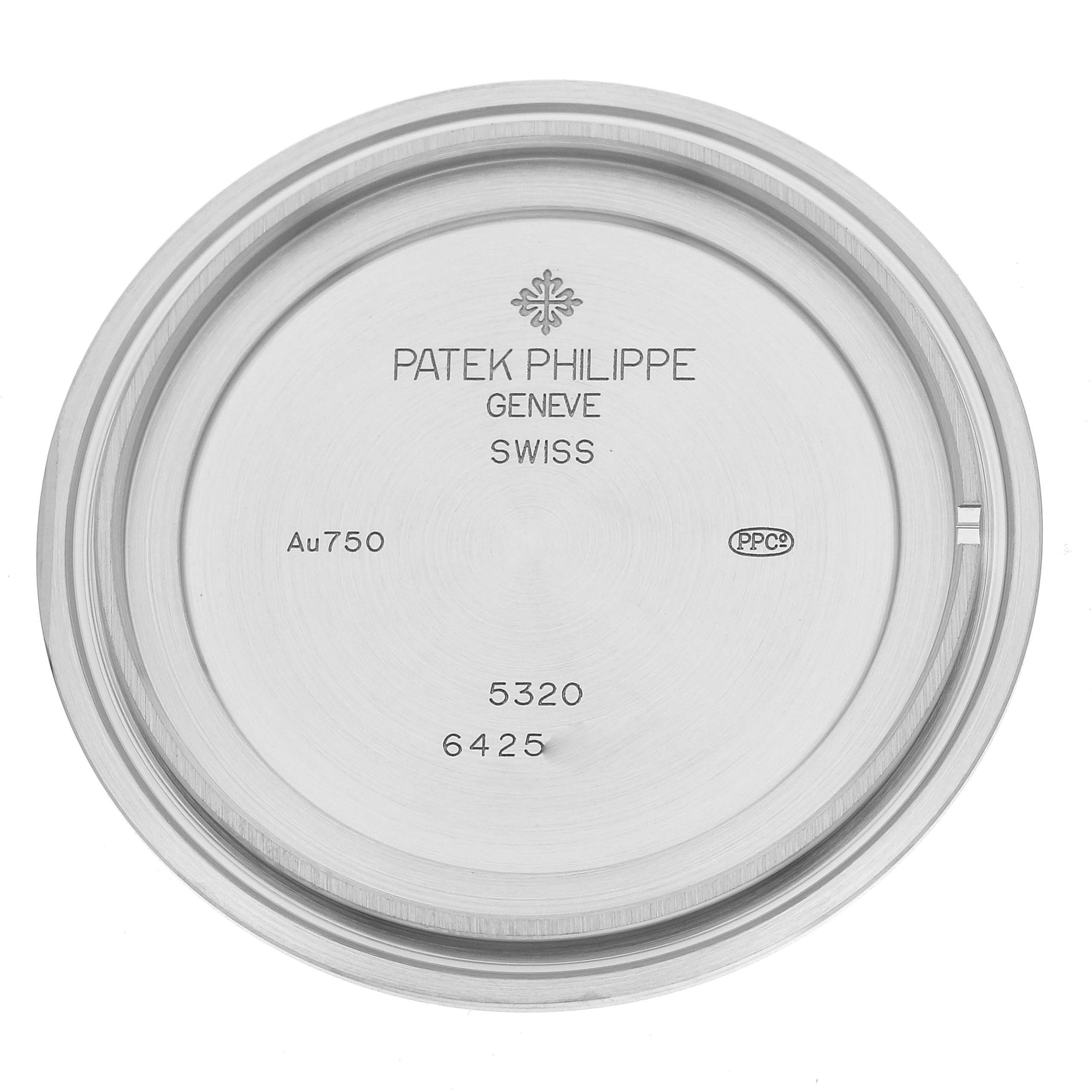 This image shows the inner case back of a Patek Philippe Complications 5320G-001 Men's White Gold White Dial 5320G-001 Men's White Gold White Dial model, with engravings and hallmarks visible.