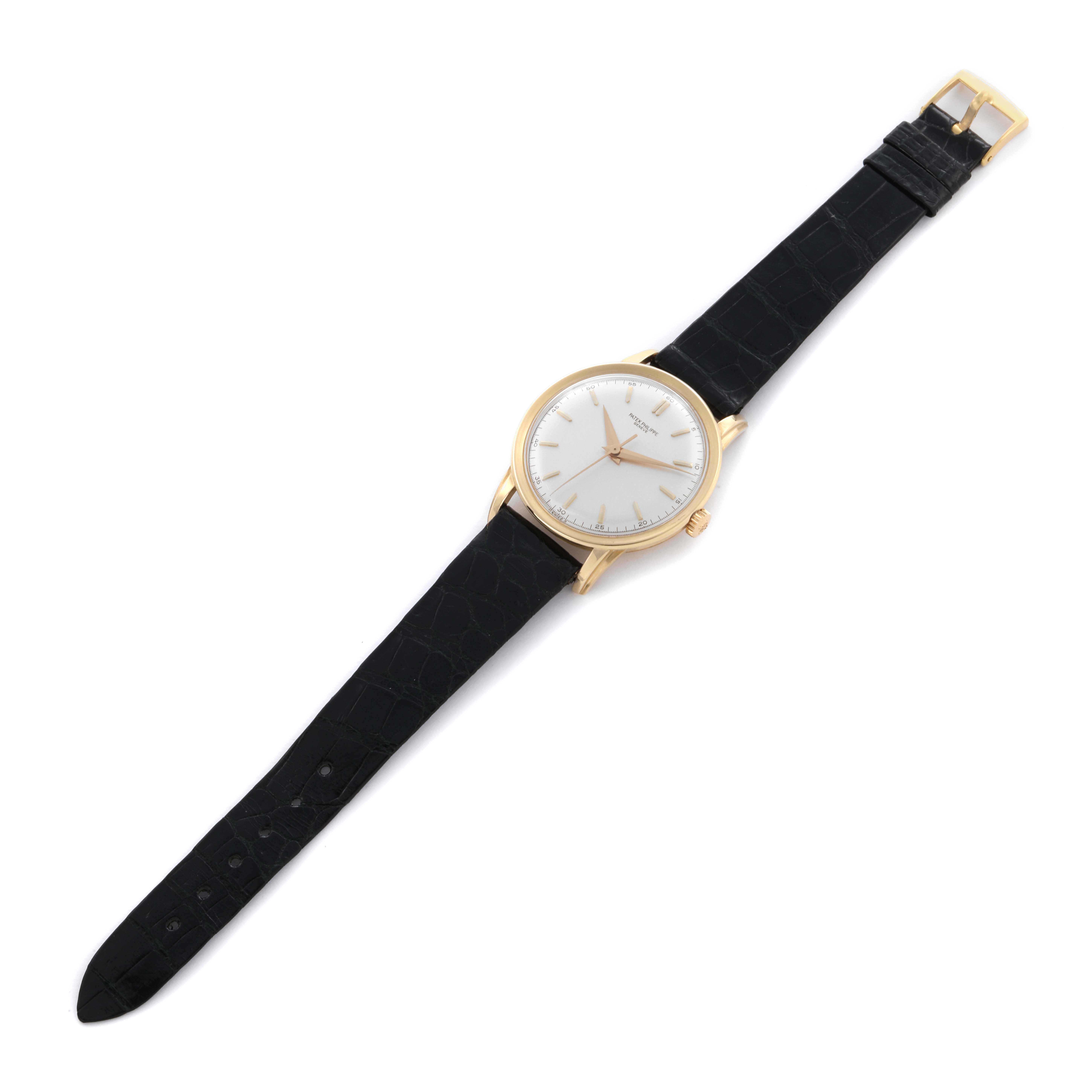 The Patek Philippe Calatrava 2481 Men's Yellow Gold Silver Dial 2481 Men's Yellow Gold Silver Dial watch is shown at a slight angle, displaying the face, case, crown, and full leather strap.