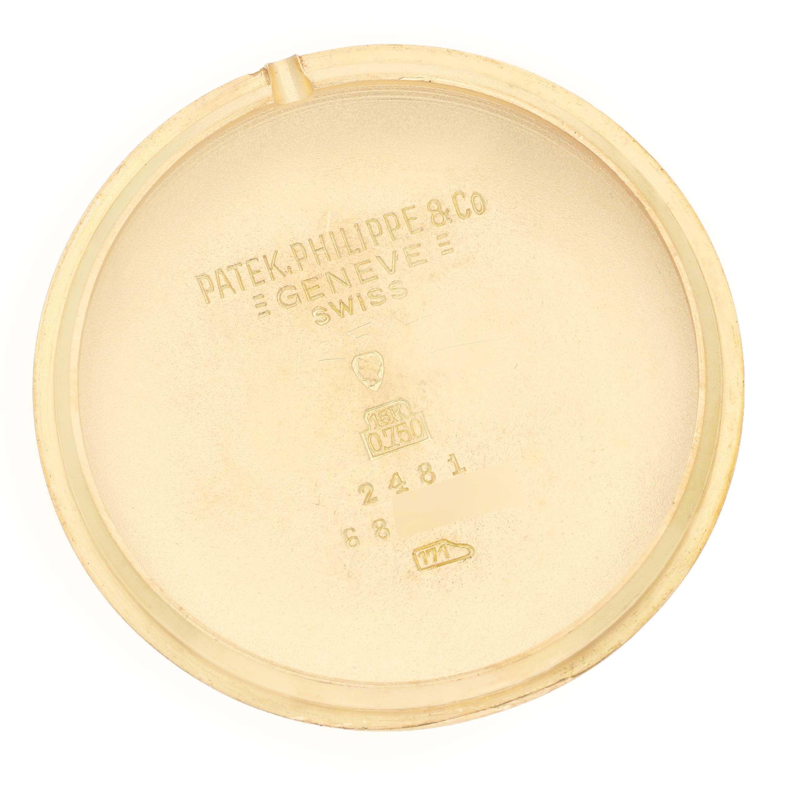 The image shows the inner case back of a Patek Philippe Calatrava 2481 Men's Yellow Gold Silver Dial watch, viewed from above, with engravings visible.