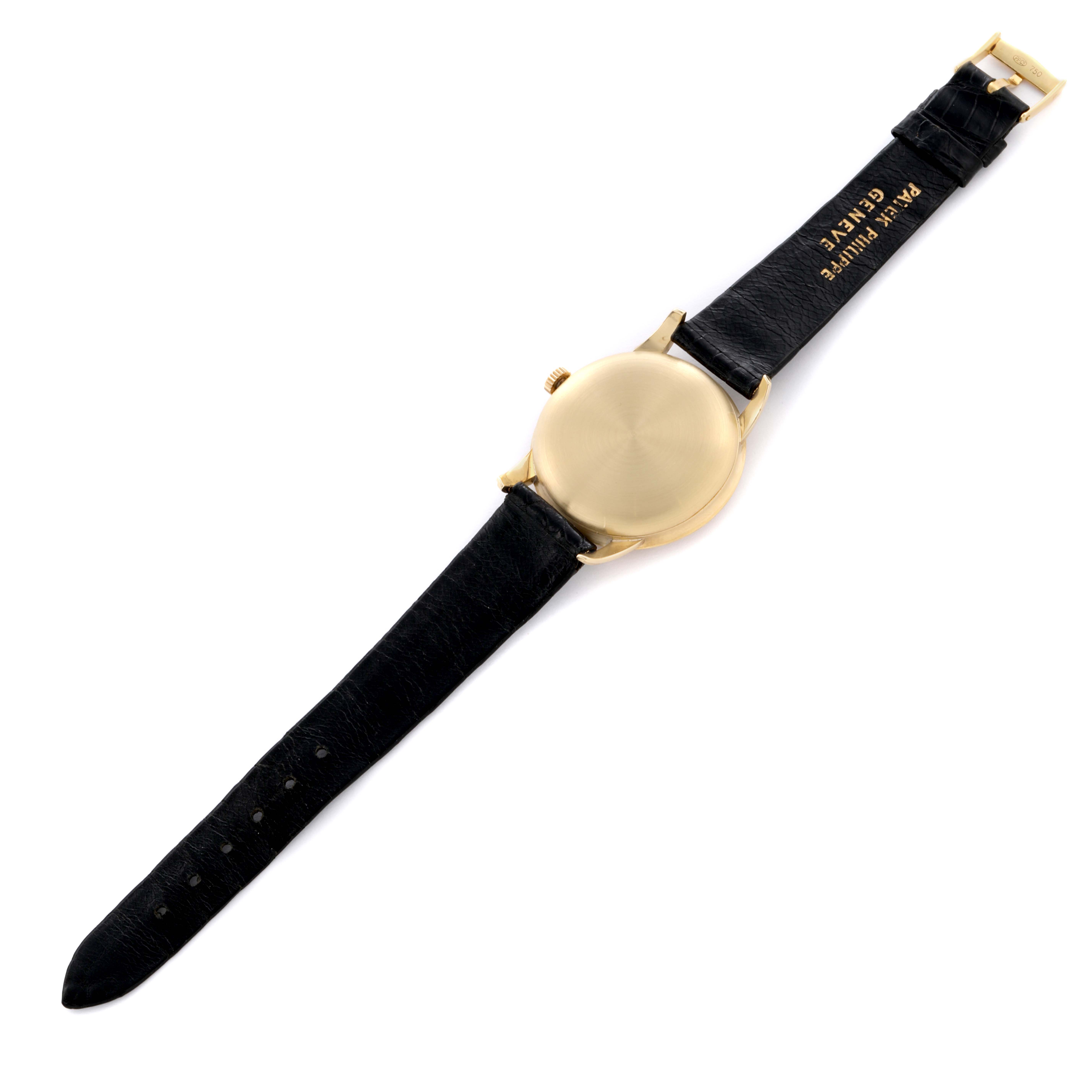 The image shows the back case and strap of a Patek Philippe Calatrava 2481 Men's Yellow Gold Silver Dial 2481 Men's Yellow Gold Silver Dial watch from a top-down angle.