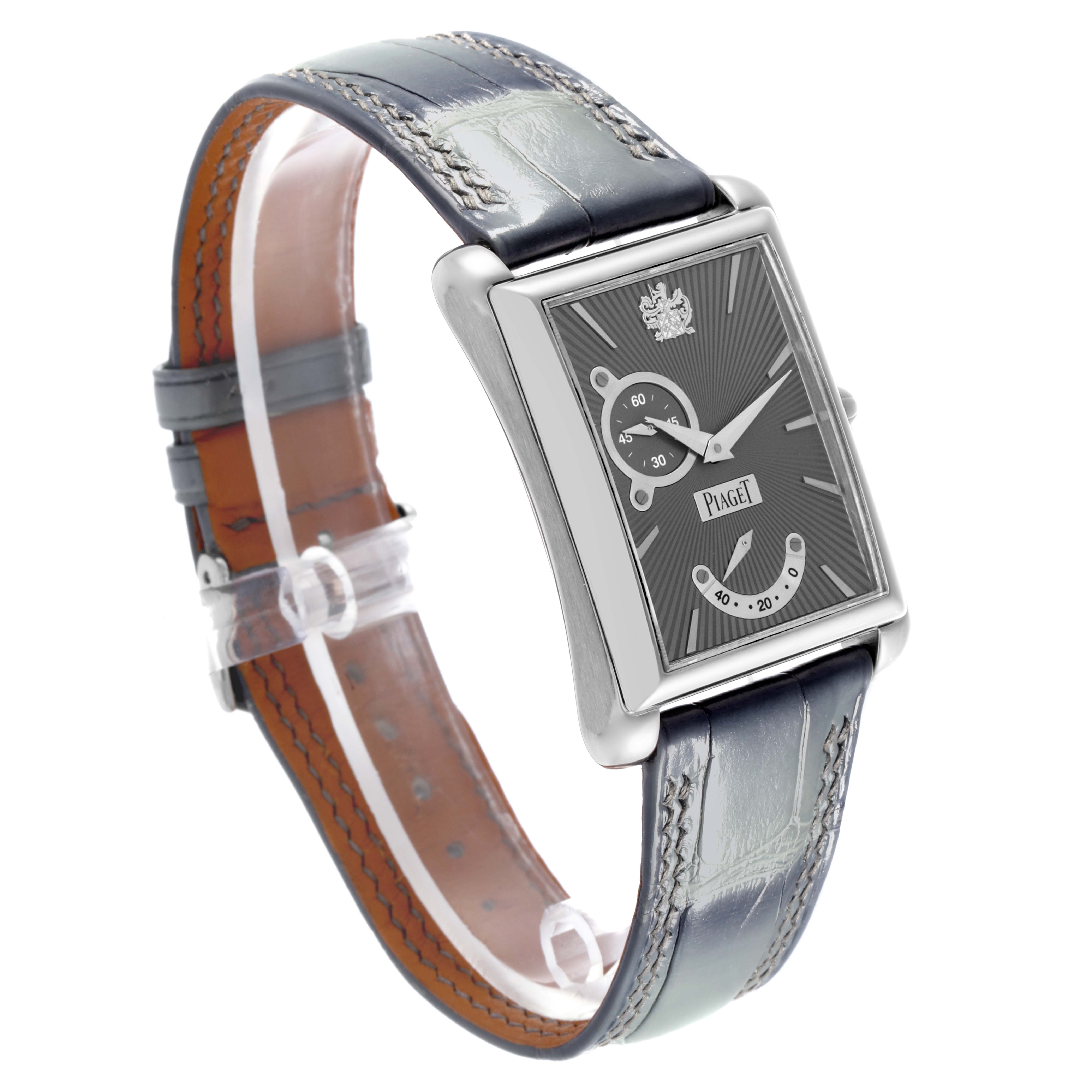 The Piaget P10566 Men's Yellow Gold Grey Dial P10566 Men's Yellow Gold Grey Dial Emperador Automatic P10566 watch is shown at a three-quarter angle, displaying the face, case, crown, and leather strap.