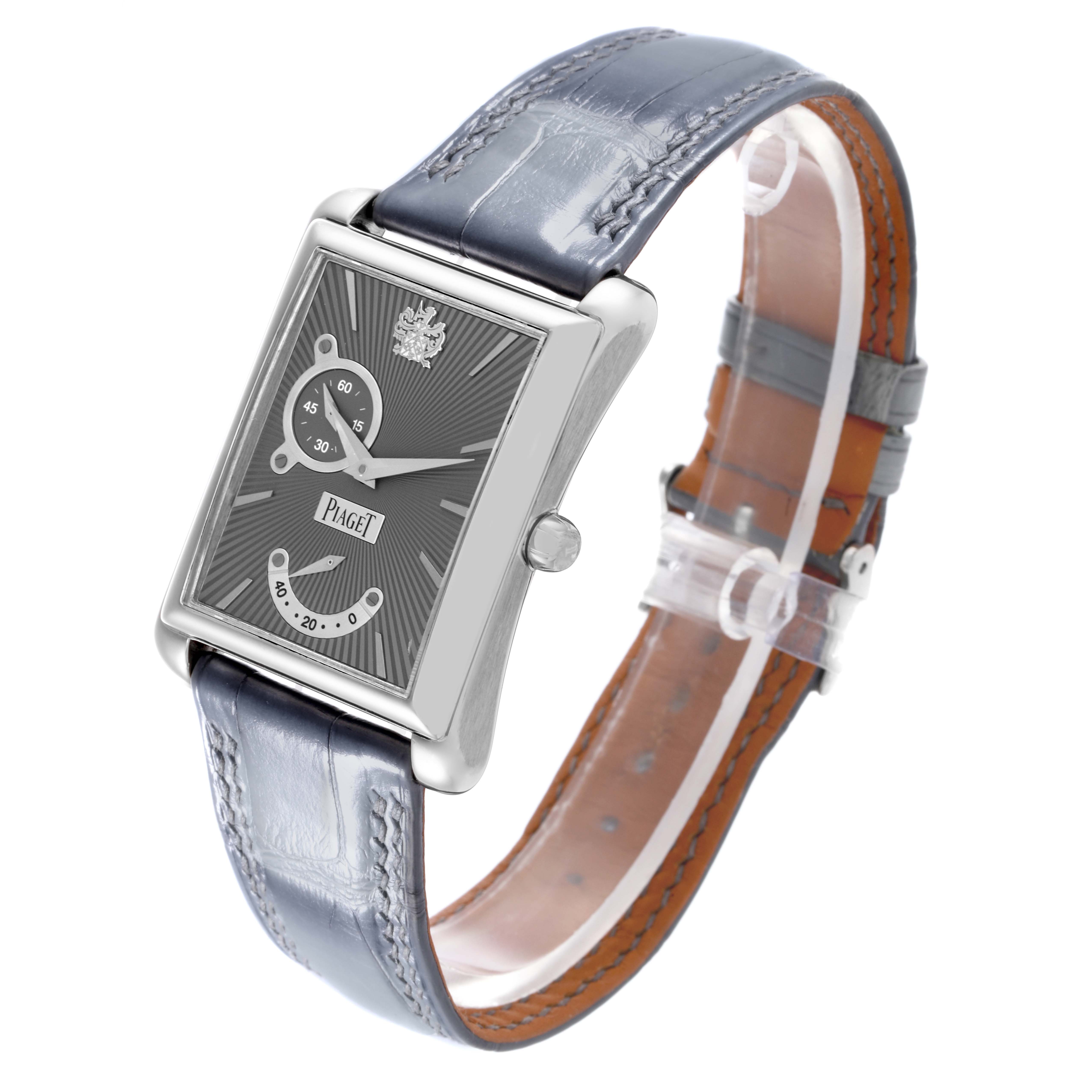 The Piaget P10566 Men's Yellow Gold Grey Dial P10566 Men's Yellow Gold Grey Dial Emperador Automatic P10566 watch is shown at a three-quarter angle, displaying its rectangular face, dial details, and leather strap.