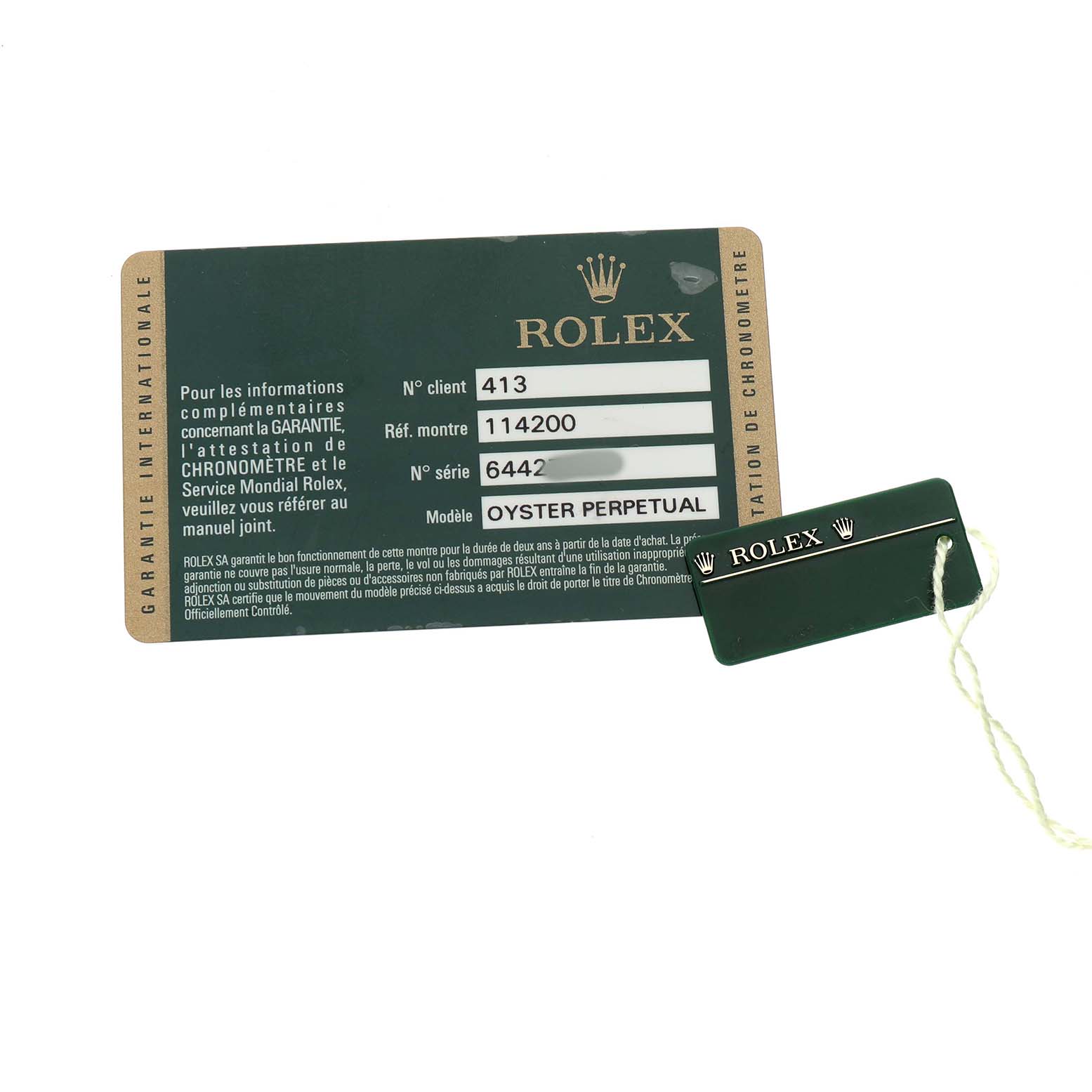 This image shows a warranty card and hang tag for a Rolex Air-King 114200 Men's Stainless Steel White Dial watch, model Oyster Perpetual.