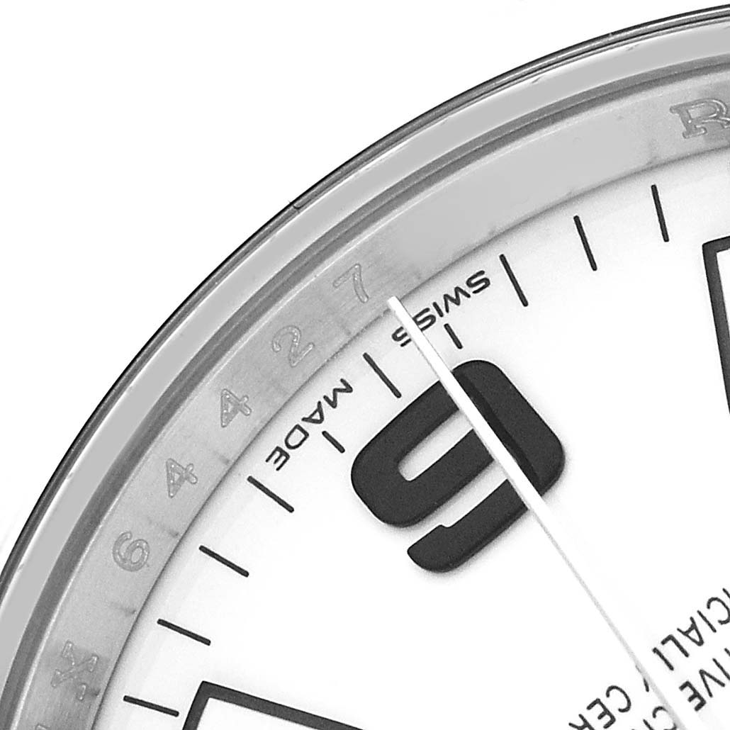 The image shows a close-up of the Rolex Air-King 114200 Men's Stainless Steel White Dial watch face, focusing on the “9” marker and "Swiss Made" text.