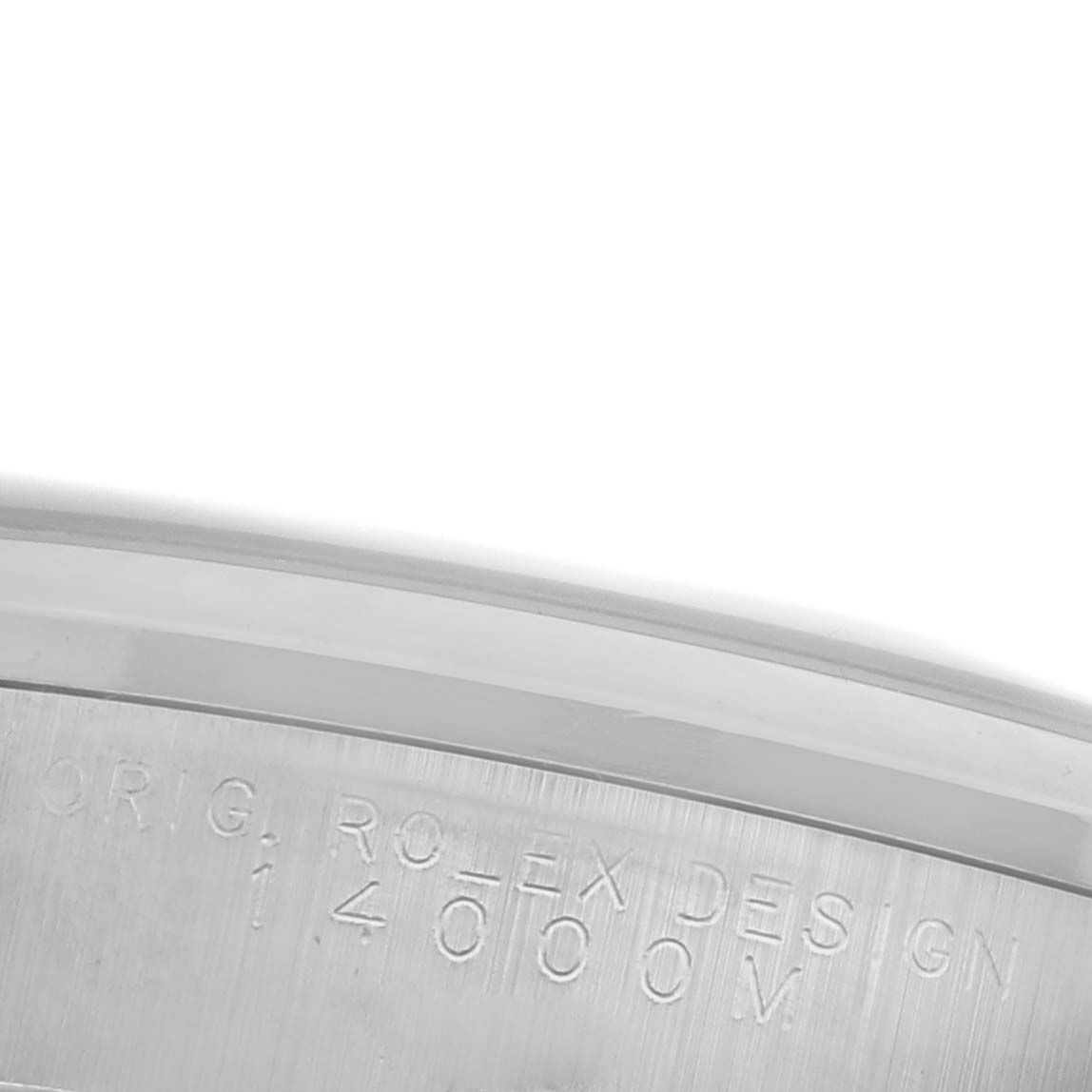 The image shows a close-up of the side engraving on the bezel of the Rolex Air-King 14000M Men's Stainless Steel Pink Dial 14000M Men's Stainless Steel Pink Dial watch.