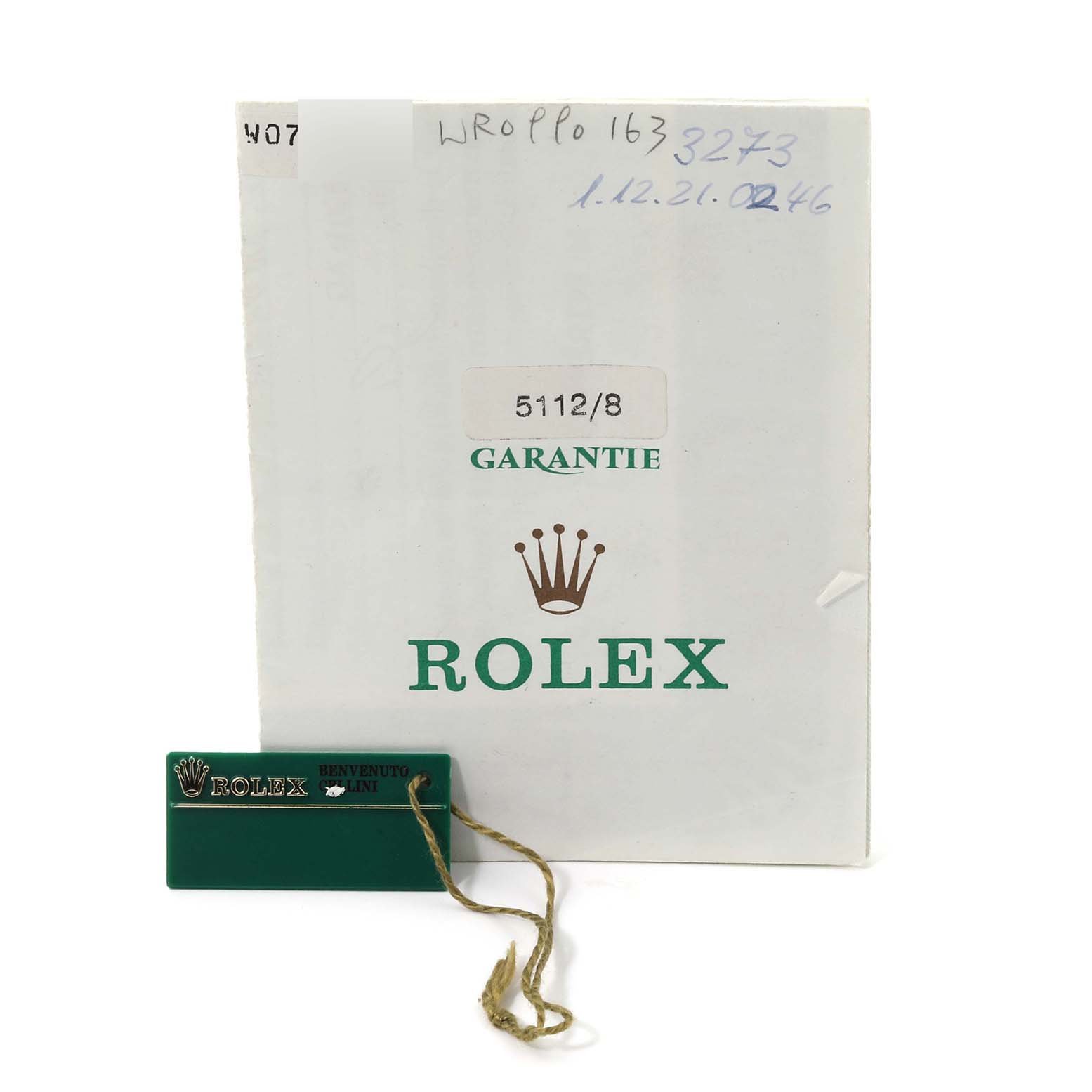 This image shows a warranty document and tag for a Rolex Cellini 5112/8 Men
s Yellow Gold Champagne Dial 5112/8 Men
s Yellow Gold Champagne Dial watch model 5112/8.