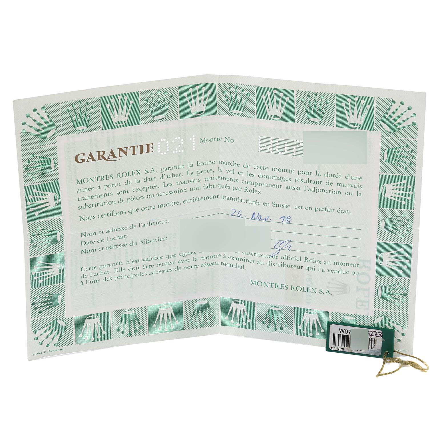 The image shows the warranty certificate and tag accessories for a Rolex Cellini 5112/8 Men
s Yellow Gold Champagne Dial 5112/8 Men
s Yellow Gold Champagne Dial model watch.