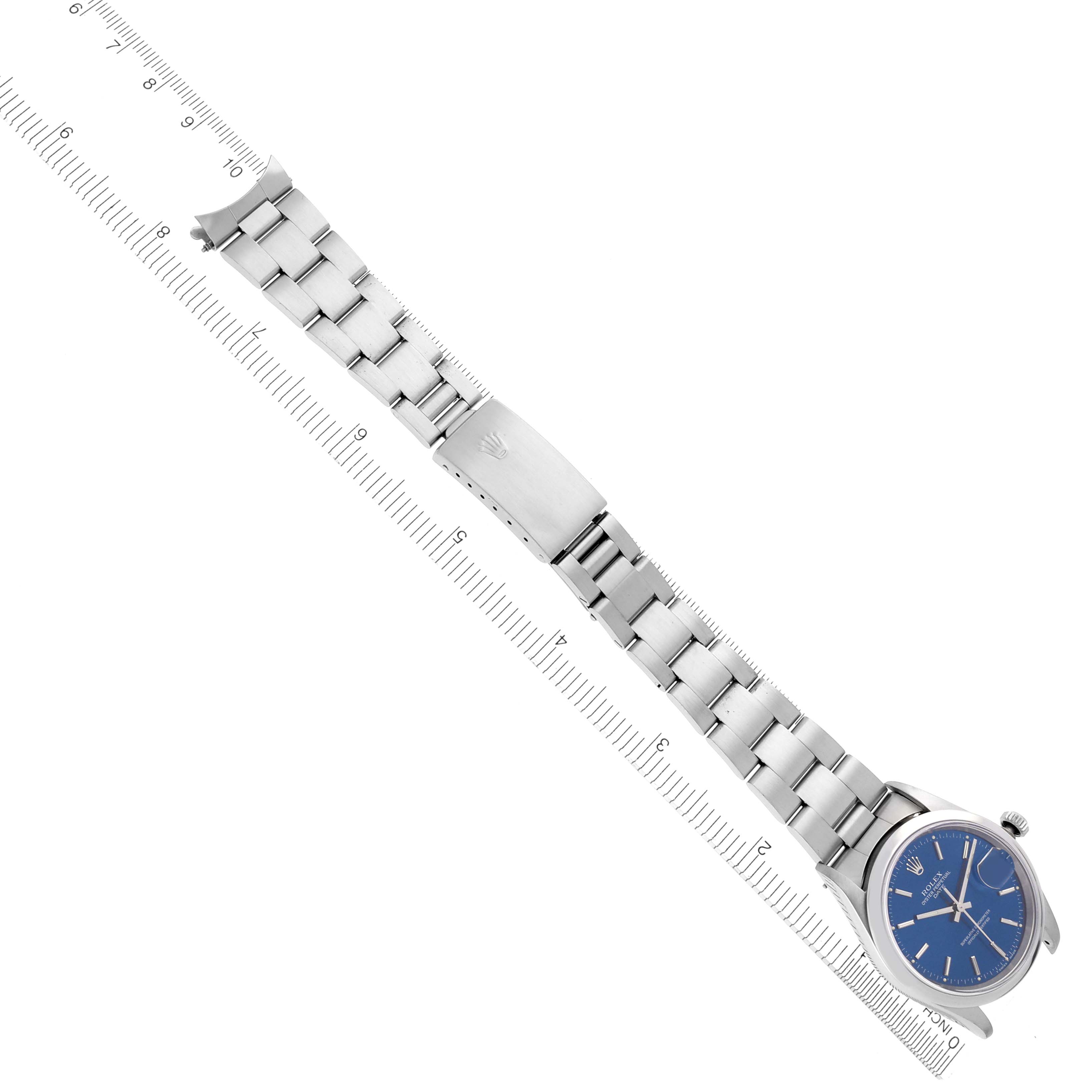 The Rolex Date 15200 Men's Stainless Steel Blue Dial watch is shown at an angle revealing the bracelet and clasp, with a blue dial in view.