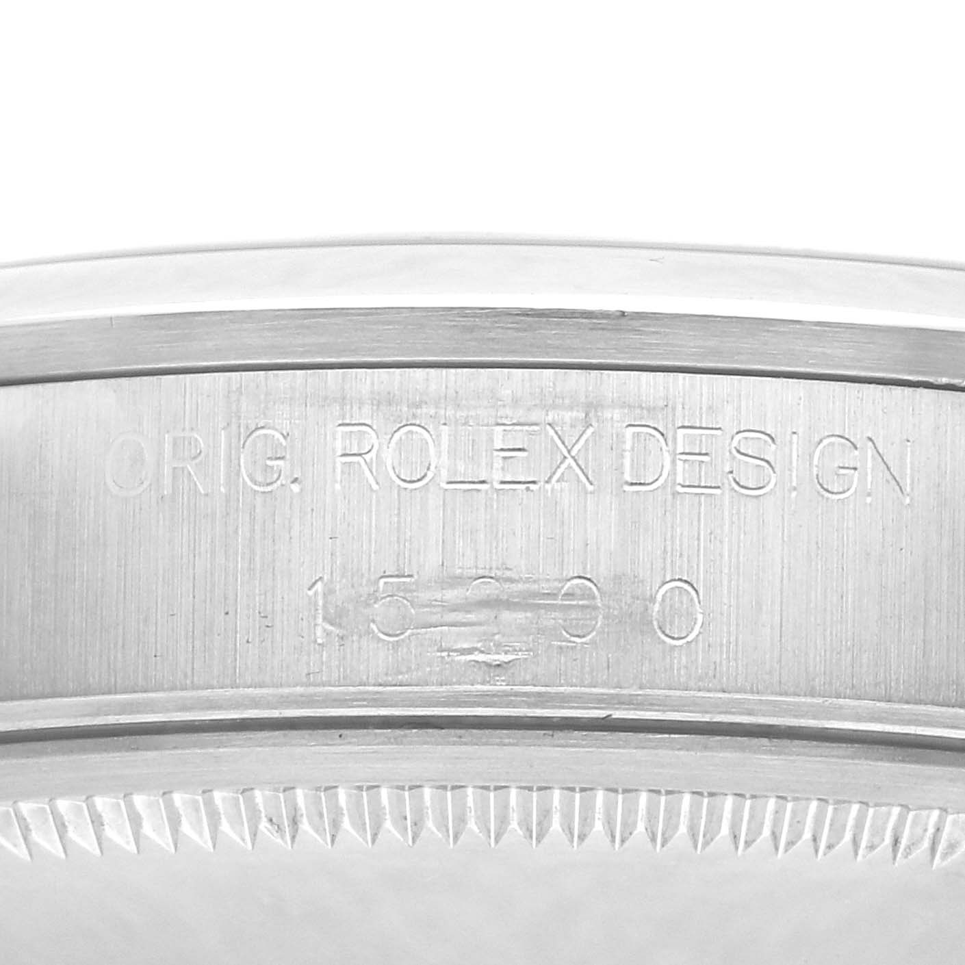 The image shows a close-up of the case side of the Rolex Date 15200 Men's Stainless Steel Blue Dial, highlighting the engraved model number and design details.