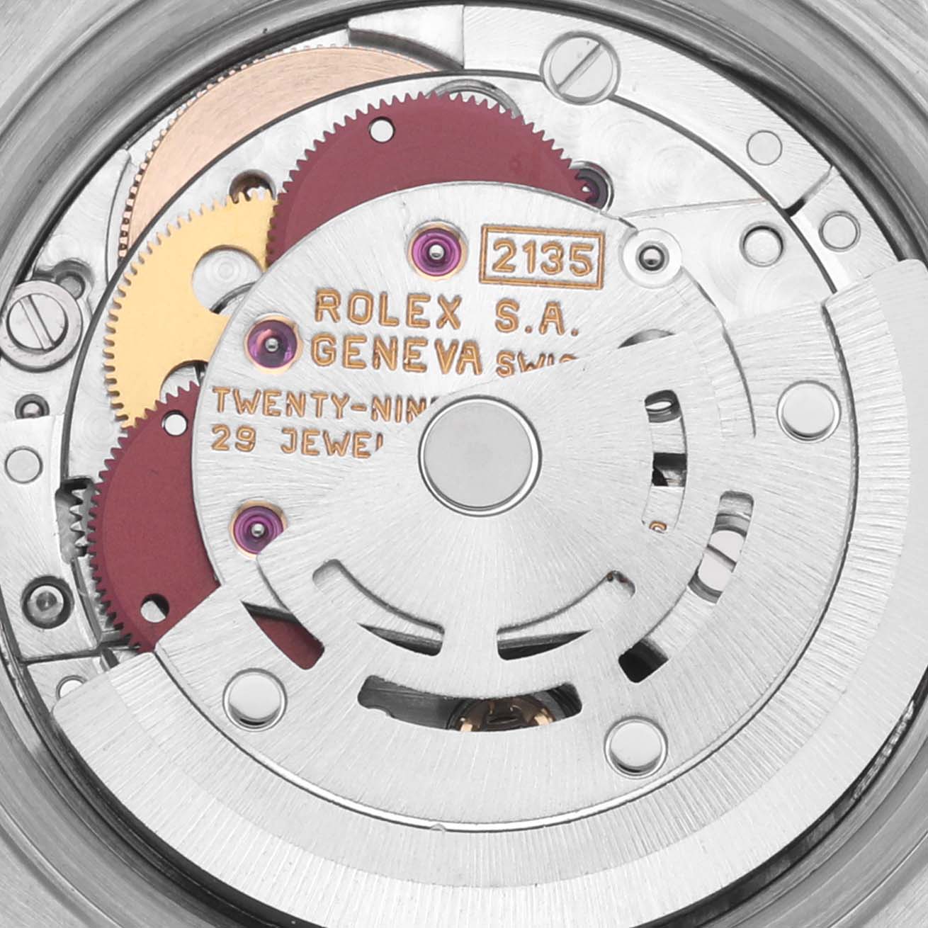 The image shows a close-up of the Rolex Date 69160 Women's Stainless Steel Blue Dial 69160 Women's Stainless Steel Blue Dial model's movement, highlighting gears and jewels from the back.