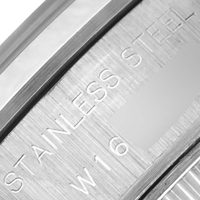 The image shows a close-up of the back casing of a Rolex Date 69160 Women's Stainless Steel Blue Dial 69160 Women's Stainless Steel Blue Dial watch, highlighting the "STAINLESS STEEL" engraving.