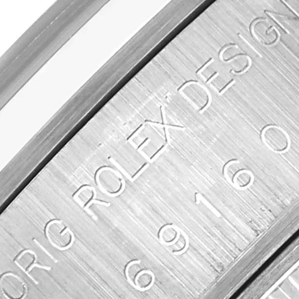 The image shows an engraved side of a Rolex Date 69160 Women's Stainless Steel Blue Dial 69160 Women's Stainless Steel Blue Dial watch case with model and serial details.