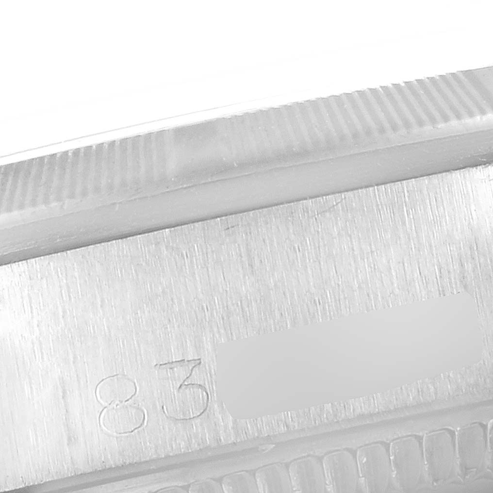 This close-up image shows the side case and part of the bezel of a Rolex Date 6519 Women
s Stainless Steel Silver Dial 6519 Women
s Stainless Steel Silver Dial model watch, including a partial serial number.