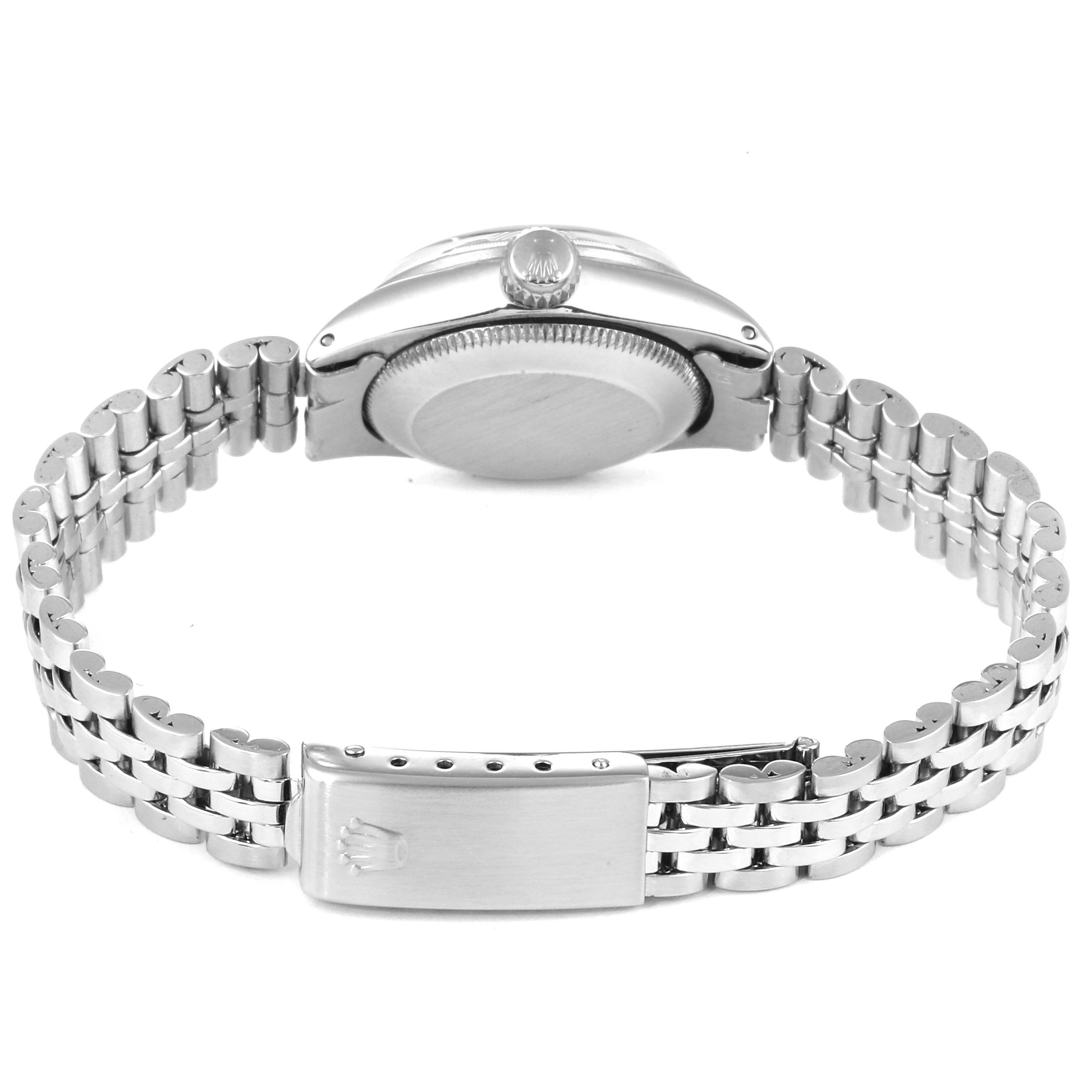 The image shows the back view of a Rolex Date 6519 Women
s Stainless Steel Silver Dial 6519 Women
s Stainless Steel Silver Dial model watch, highlighting the clasp, bracelet, and case back.