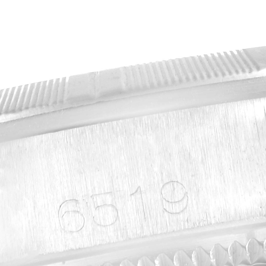 This image shows a close-up of the case and model number (6519) on a Rolex Date 6519 Women
s Stainless Steel Silver Dial 6519 Women
s Stainless Steel Silver Dial watch.