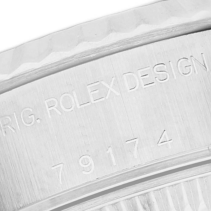 The image shows a close-up of the Rolex Datejust 79174 Women's Stainless Steel Mother of Pearl Dial case, focusing on the engraved side with model and design markings.