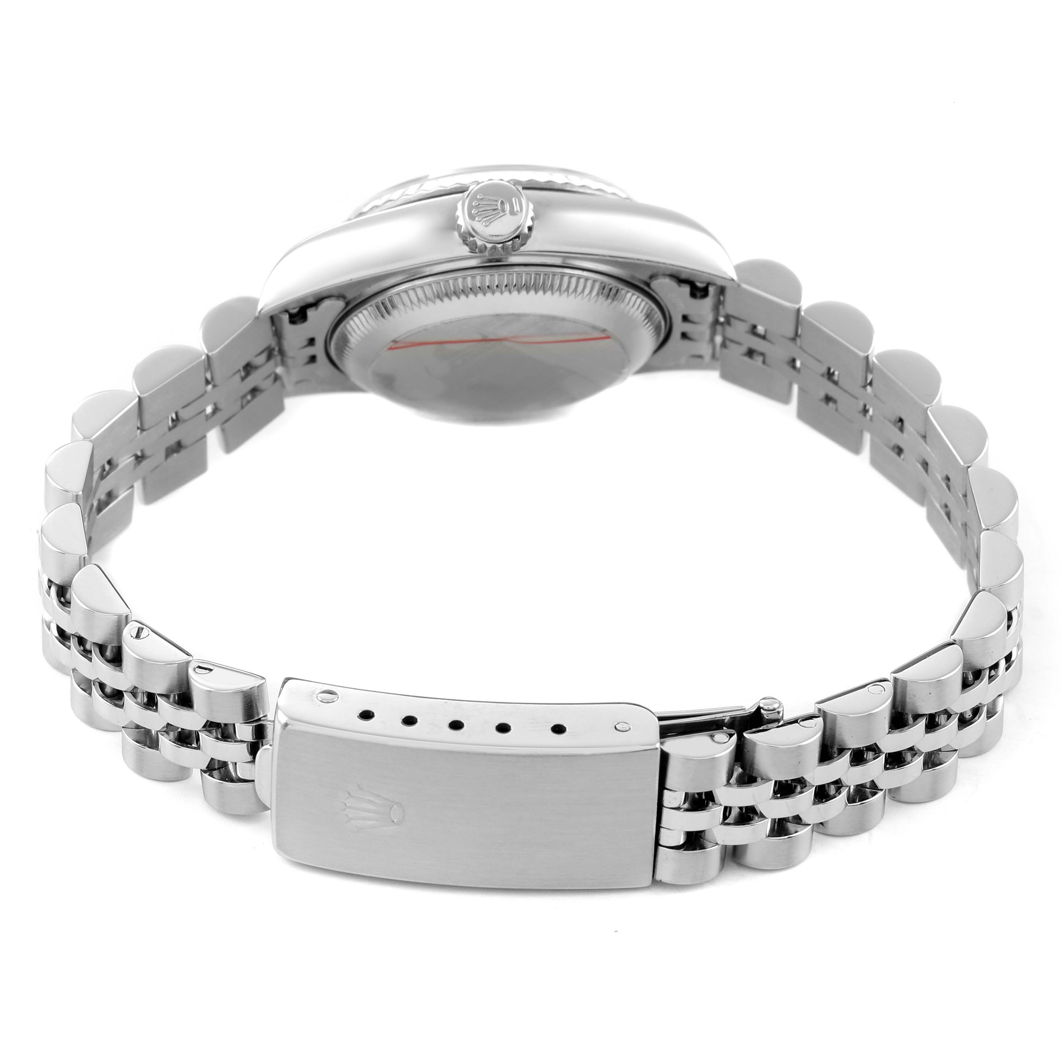 The image shows the side view of a Rolex Datejust 79174 Women's Stainless Steel Mother of Pearl Dial, highlighting the crown, case, and bracelet with the clasp.