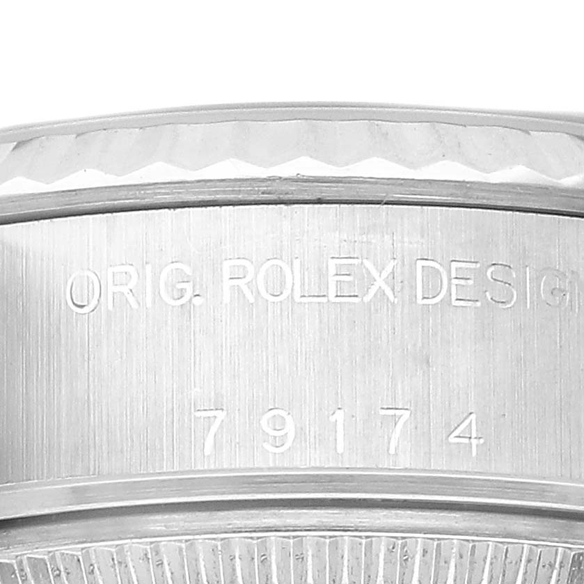 The image shows a close-up of the Rolex Datejust 79174 Women's Stainless Steel Silver Dial model's side casing, featuring engraved design details and model number.