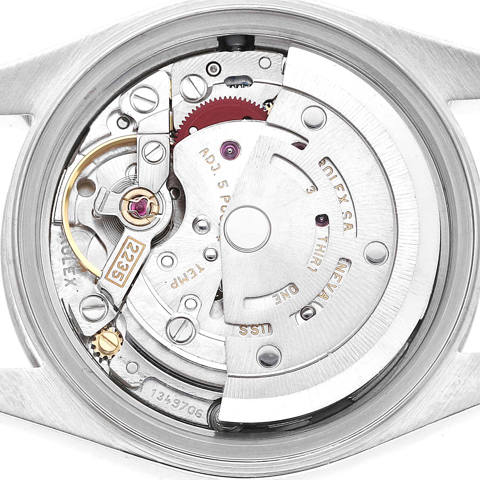 The image shows the internal mechanism of a Rolex Datejust 79174 Women's Stainless Steel Silver Dial watch viewed from the back, revealing gears and components.