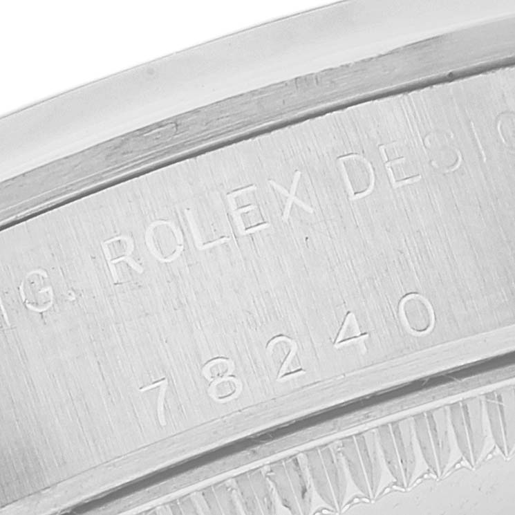 This image shows a close-up of the case back engraving on a Rolex Mid-Size 78240 Women's Stainless Steel Pink Dial 78240 Women's Stainless Steel Pink Dial model watch.