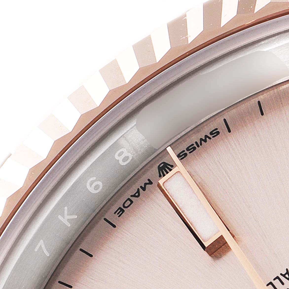 The image shows a close-up of the dial and fluted bezel of a Rolex Datejust 41 126331 Men's Steel and Gold (two tone) Beige Dial 126331 Men's Steel and Gold (two tone) Beige Dial watch, featuring part of the minute markers and "Swiss Made" text.