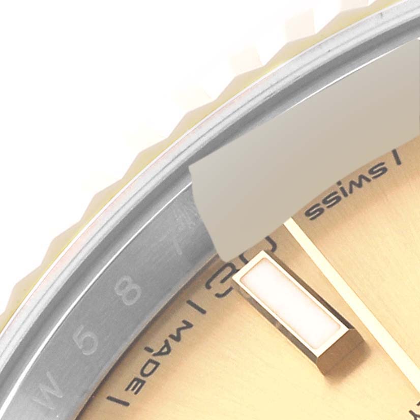 The image shows a close-up of the dial, bezel, and hour marker of a Rolex Datejust 41 126333 Men's Steel and Gold (two tone) Champagne Dial.