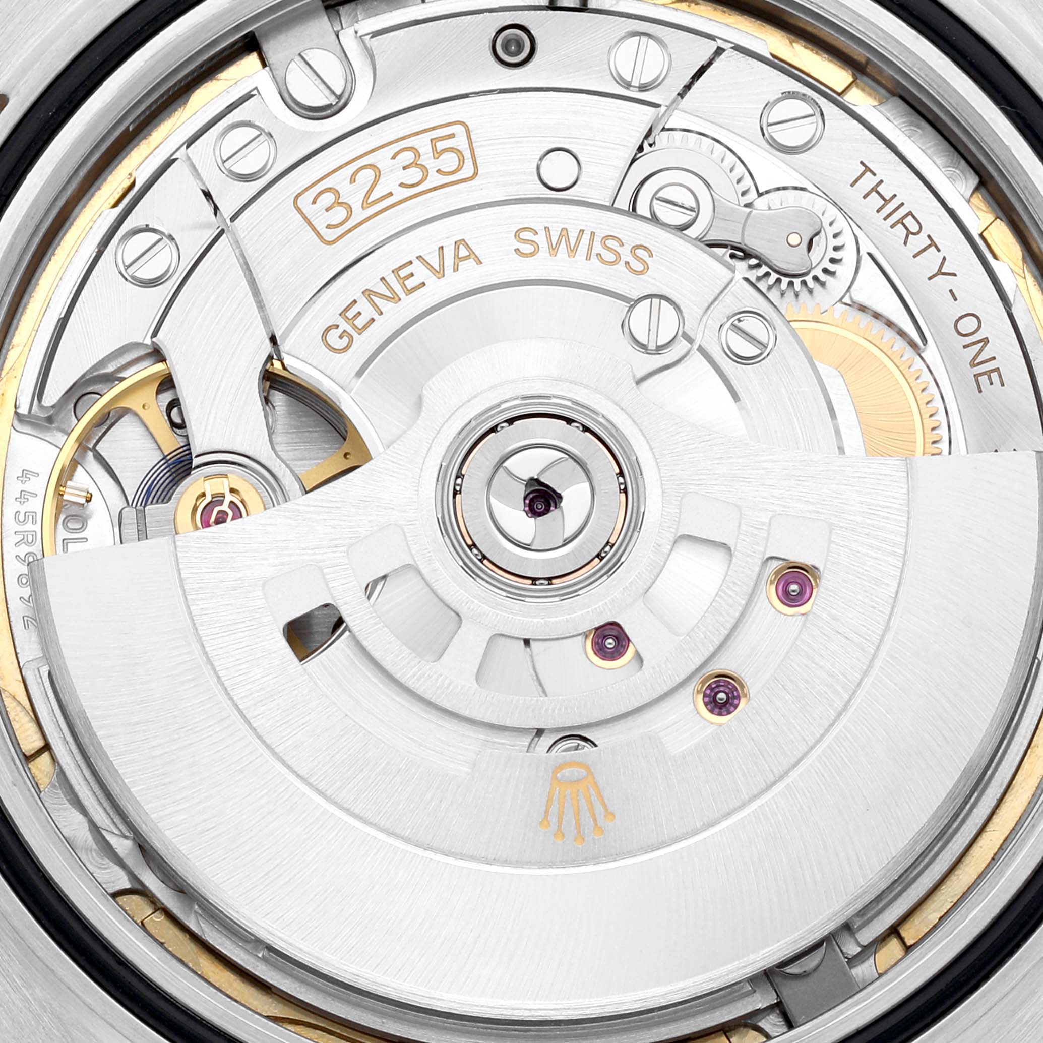This image shows the intricate details of the movement inside a Rolex Datejust 41 126333 Men's Steel and Gold (two tone) Champagne Dial watch, focusing on the rotor and gears.