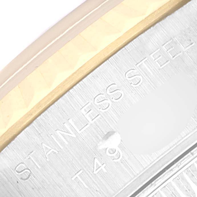 This close-up image shows a portion of the stainless steel and gold bezel of a Rolex Datejust 69173 Women's Steel and Gold (two tone) Blue Dial 69173 Women's Steel and Gold (two tone) Blue Dial watch.