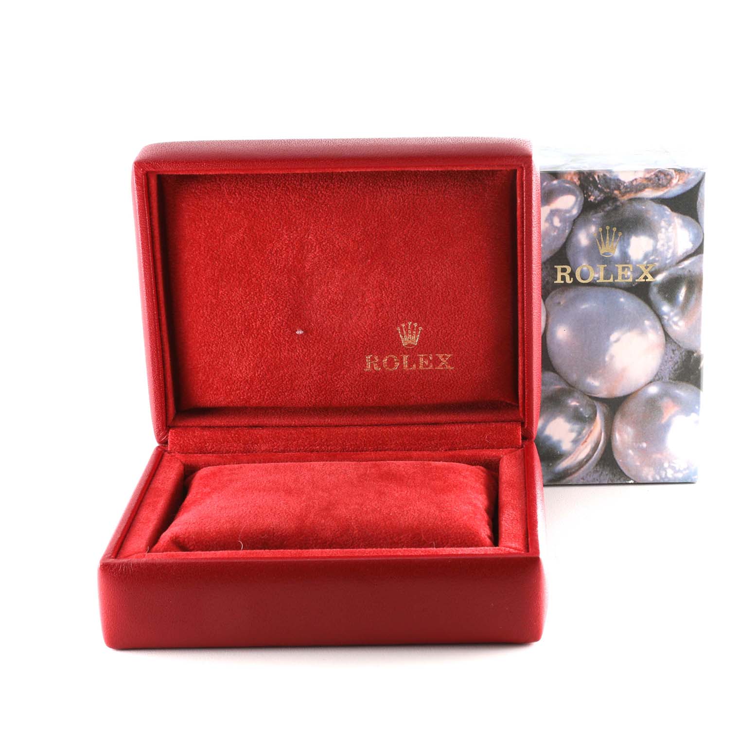 The image shows an empty red Rolex Datejust 69173 Women's Steel and Gold (two tone) Champagne Dial 69173 Women's Steel and Gold (two tone) Champagne Dial watch box with a cushion inside, alongside decorative packaging.
