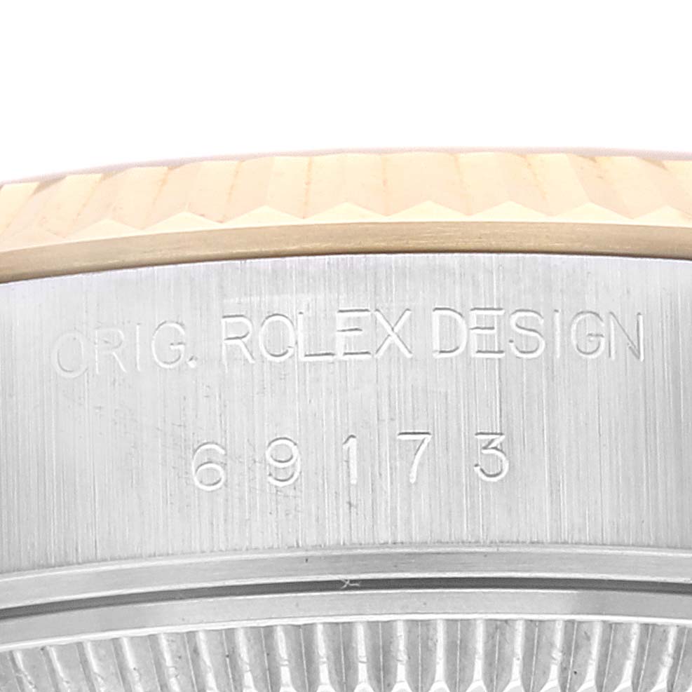 This close-up image shows the side profile of the bezel and case of a Rolex Datejust 69173 Women's Steel and Gold (two tone) Champagne Dial 69173 Women's Steel and Gold (two tone) Champagne Dial watch, revealing the watch’s model number "69173."