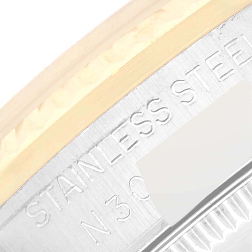 The image shows a close-up view of a Rolex Mid-Size 68273G Women's Steel and Gold (two tone) Champagne Dial 68273G Women's Steel and Gold (two tone) Champagne Dial model's case back, highlighting the stainless steel engraving.