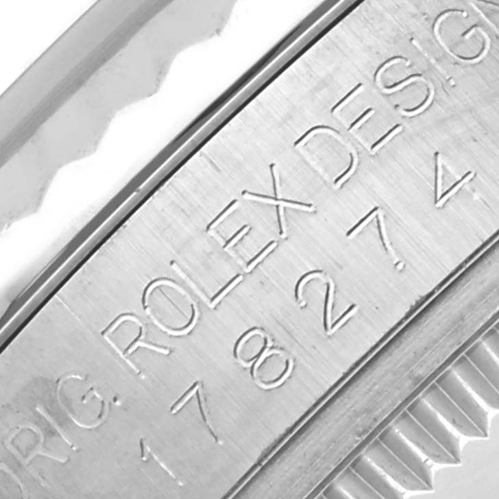 This close-up image shows the engraved side of the casing on a Rolex Mid-Size 178274 Women's Stainless Steel Mother of Pearl Dial 178274 Women's Stainless Steel Mother of Pearl Dial model, highlighting the Rolex branding.