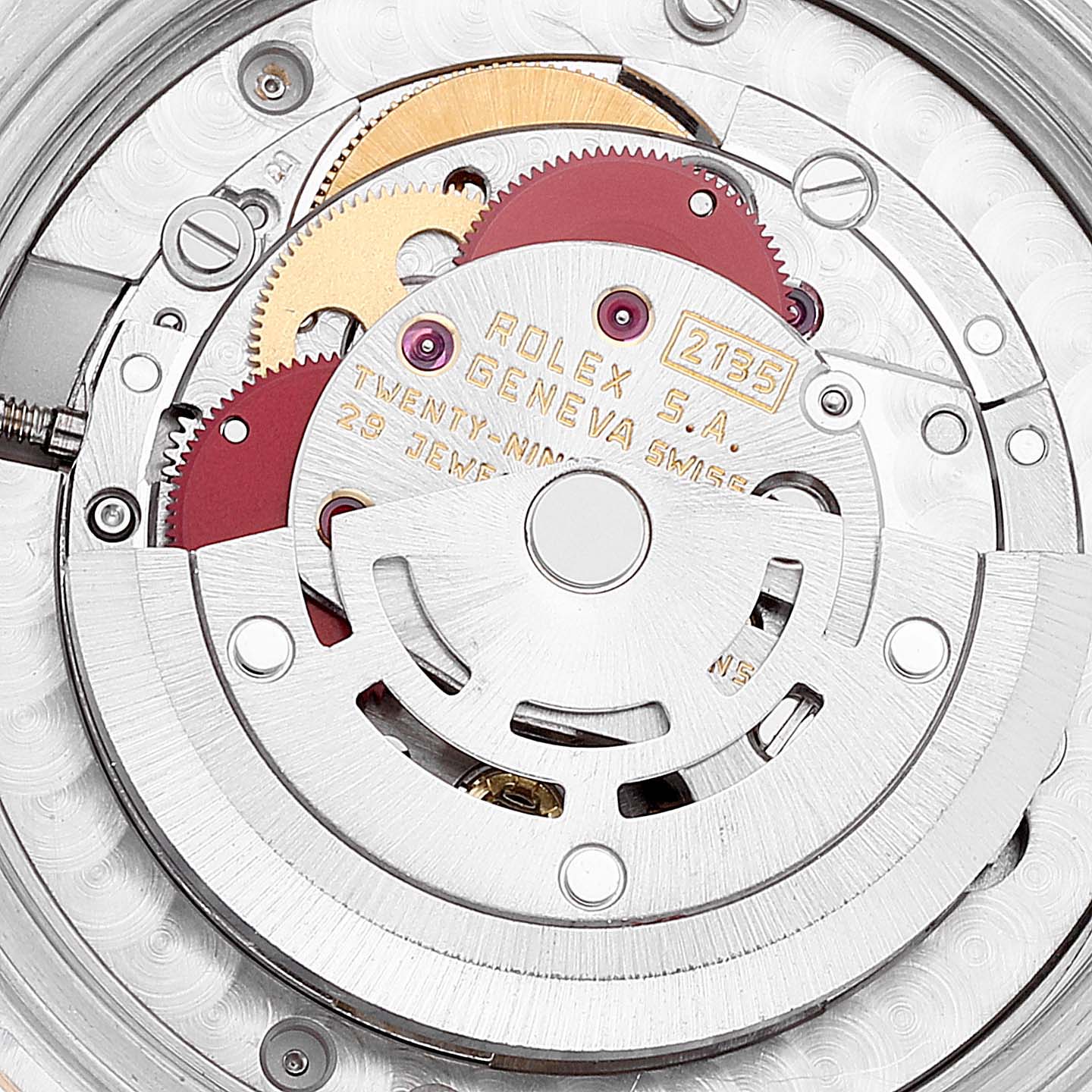 The image shows the internal mechanics of a Mid-Size Rolex watch, featuring gears and inscriptions.