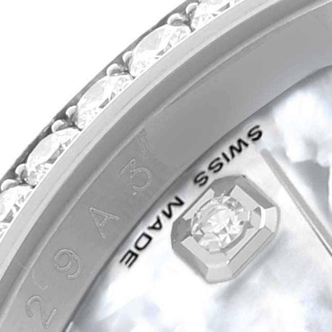 The image shows a close-up of the diamond-encrusted bezel and part of the dial of a Rolex Datejust 116244 Men's Stainless Steel Mother of Pearl Dial 116244 Men's Stainless Steel Mother of Pearl Dial watch.