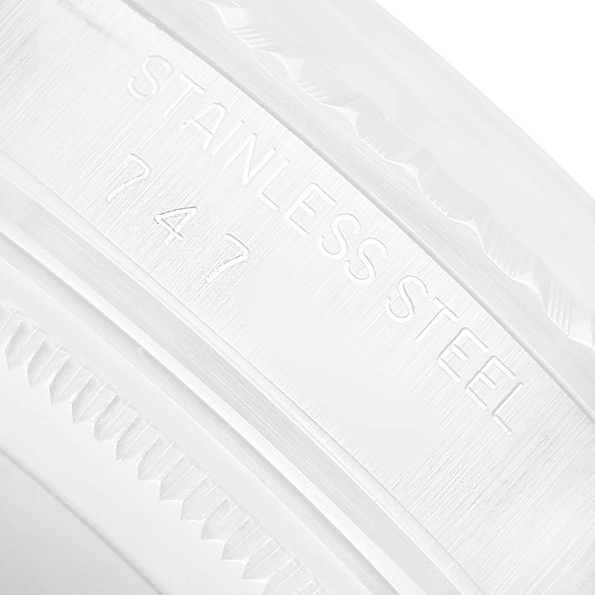 The image shows a close-up of the stainless steel bezel of a Rolex Datejust 16030 Men's Stainless Steel Silver Dial watch.