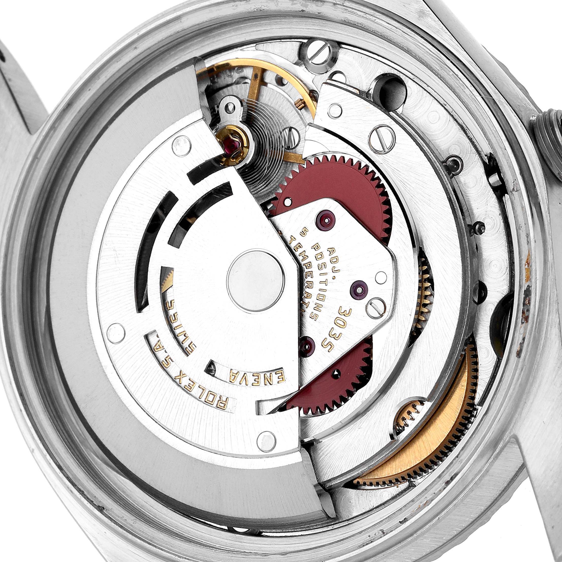 The image shows the movement of the Rolex Datejust 16030 Men's Stainless Steel Silver Dial, highlighting gears, balance wheel, and rotor from the back angle.