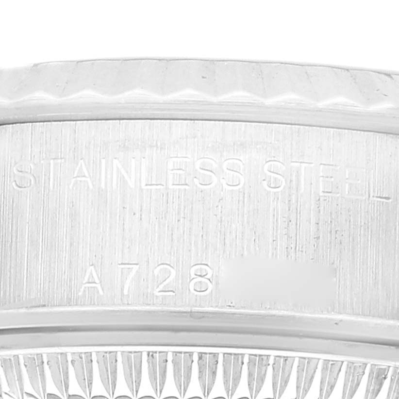 The image shows a close-up of the stainless steel case and part of the fluted bezel of a Rolex Datejust 79174 Women's Stainless Steel Pink Dial 79174 Women's Stainless Steel Pink Dial watch.