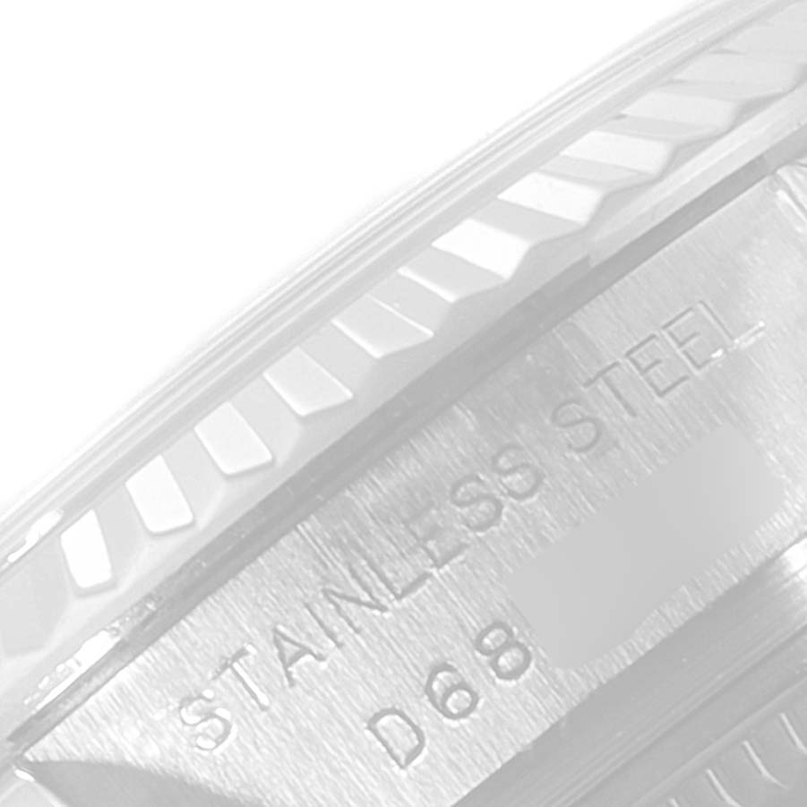 This image shows a close-up of the bezel and the stainless steel engraving on a Rolex Datejust 179174 Women's Stainless Steel Pink Dial 179174 Women's Stainless Steel Pink Dial watch.