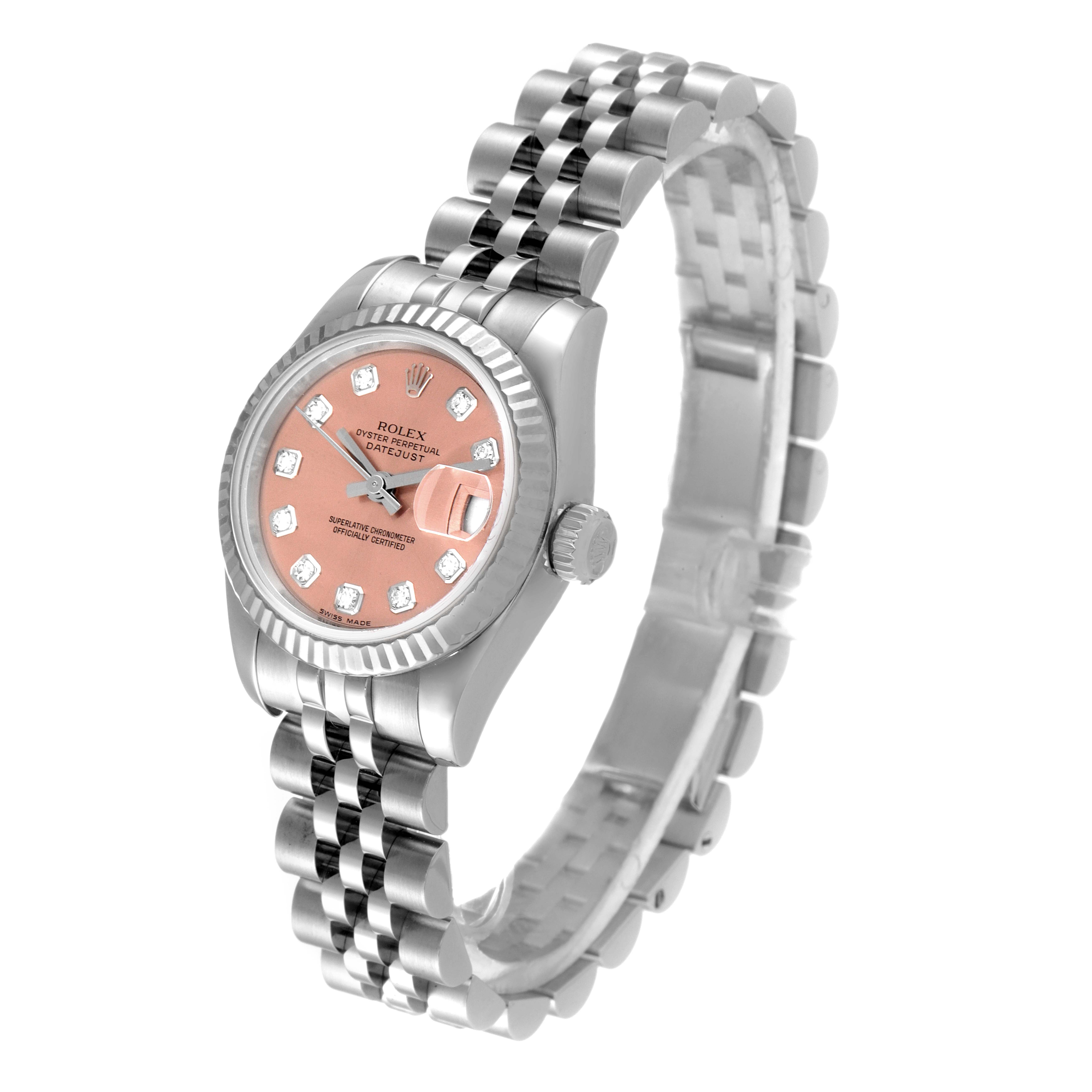 This Rolex Datejust 179174 Women's Stainless Steel Pink Dial 179174 Women's Stainless Steel Pink Dial watch is shown from an angled side view, displaying the face, bezel, case, and bracelet.
