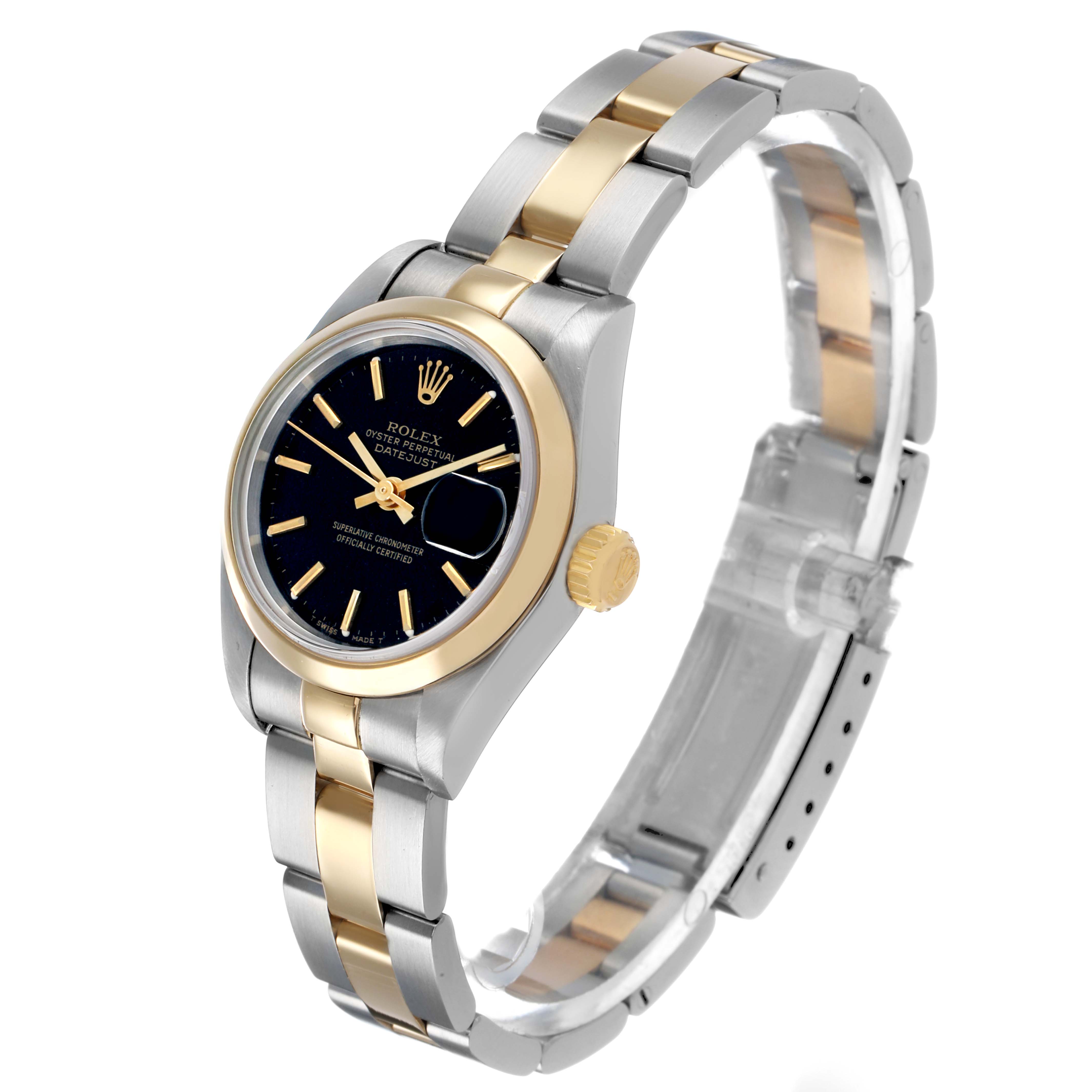 The Rolex Datejust 69163 Women's Steel and Gold (two tone) Black Dial watch is shown at a three-quarter angle, highlighting its two-tone bracelet, bezel, and dial.