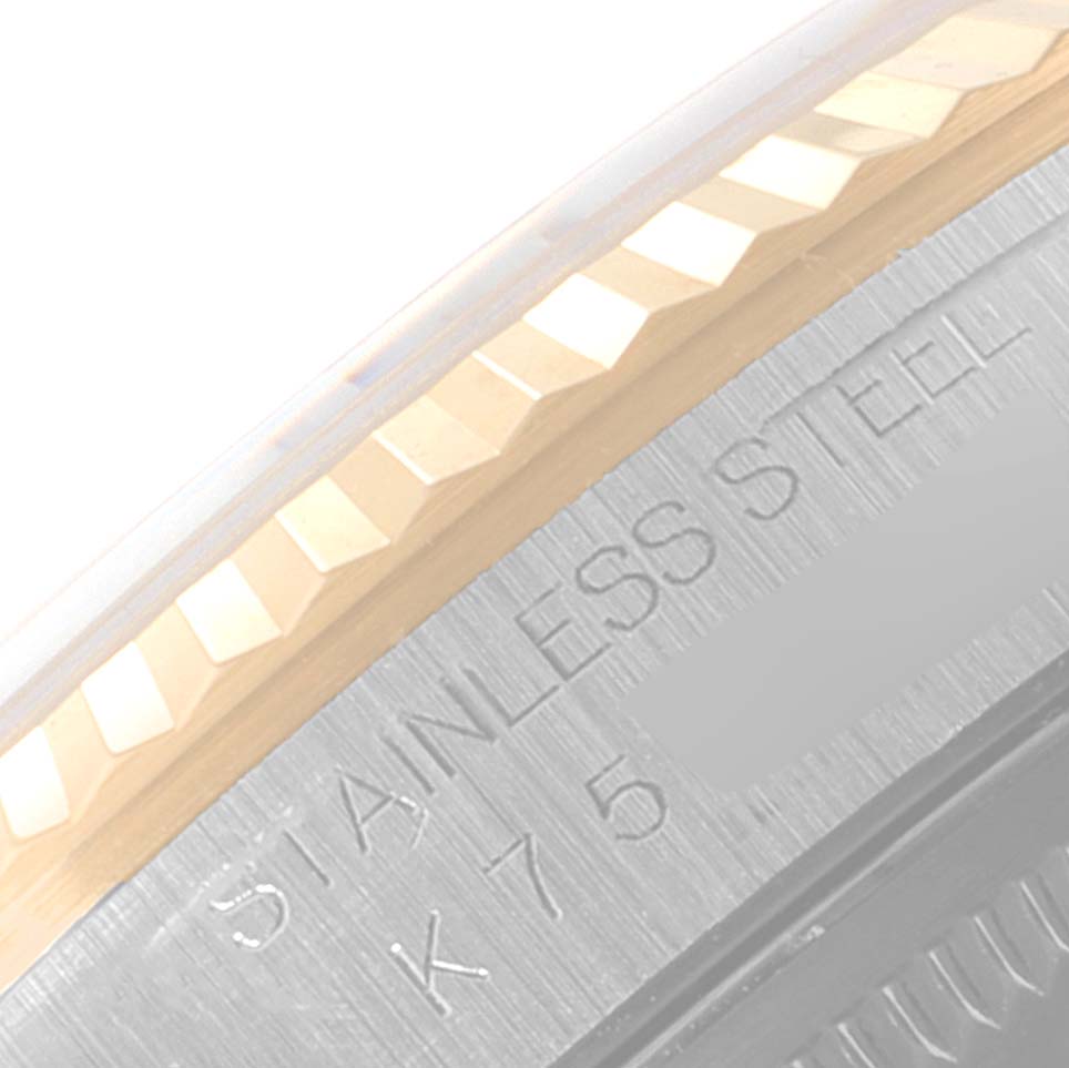 This is a close-up angle showing the fluted bezel and engraved stainless steel case of the Rolex Datejust 16233 Men's Steel and Gold (two tone) Champagne Dial 16233 Men's Steel and Gold (two tone) Champagne Dial model.